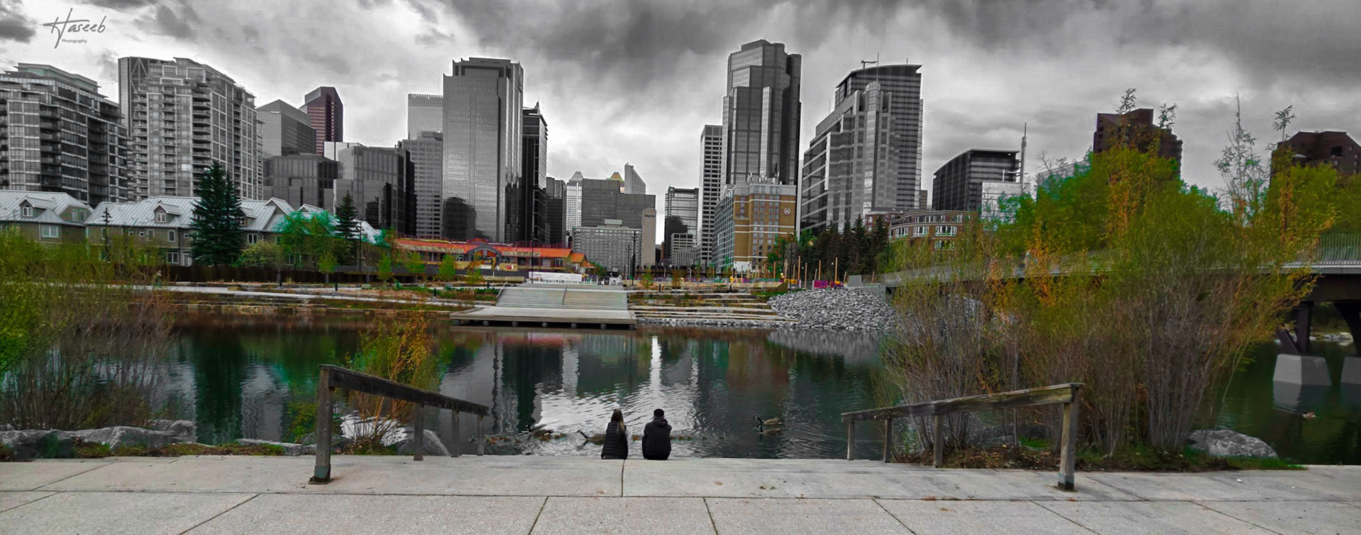 The cityscape unfolded before me like a canvas of steel and glass, a vibrant tapestry of human ingenuity and creativity. The downtown area, a hub of activity and energy was casting a contrasting image in tranquil waters.