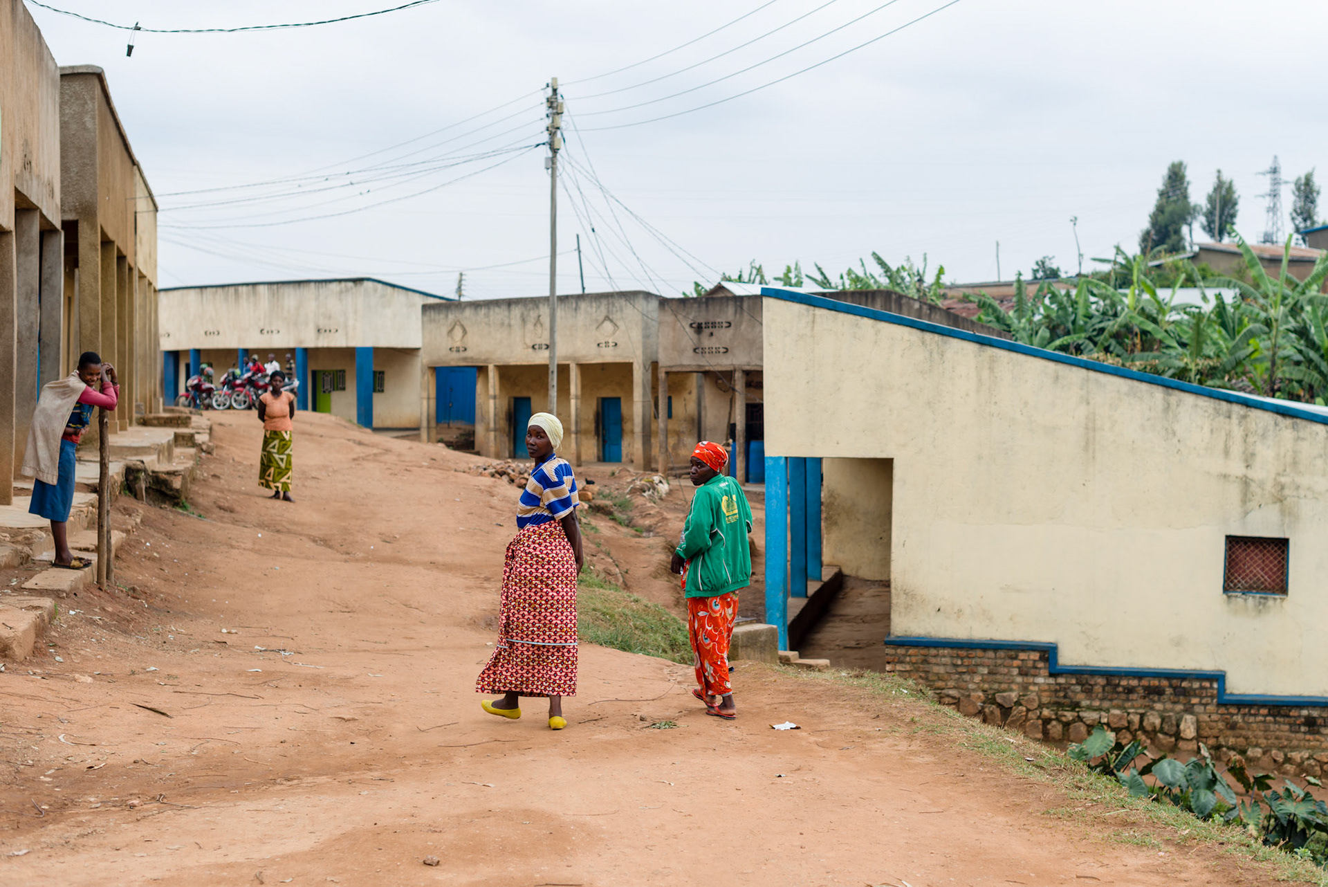 Immaculate and Philomene walk away together, off to the market.
This easy familiarity is new, developed through their membership of teh same self-help group - overcoming economic and ethnic differences.
