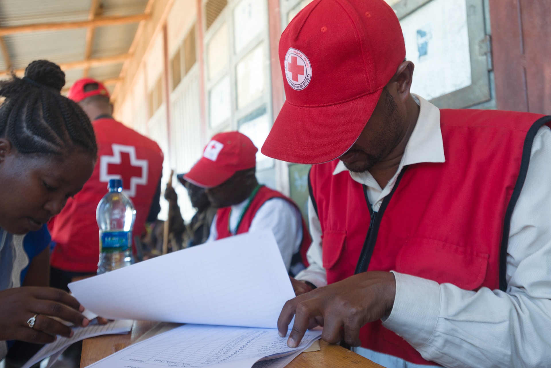 ERCS personnel registering beneficiaries against ear tag numbers.