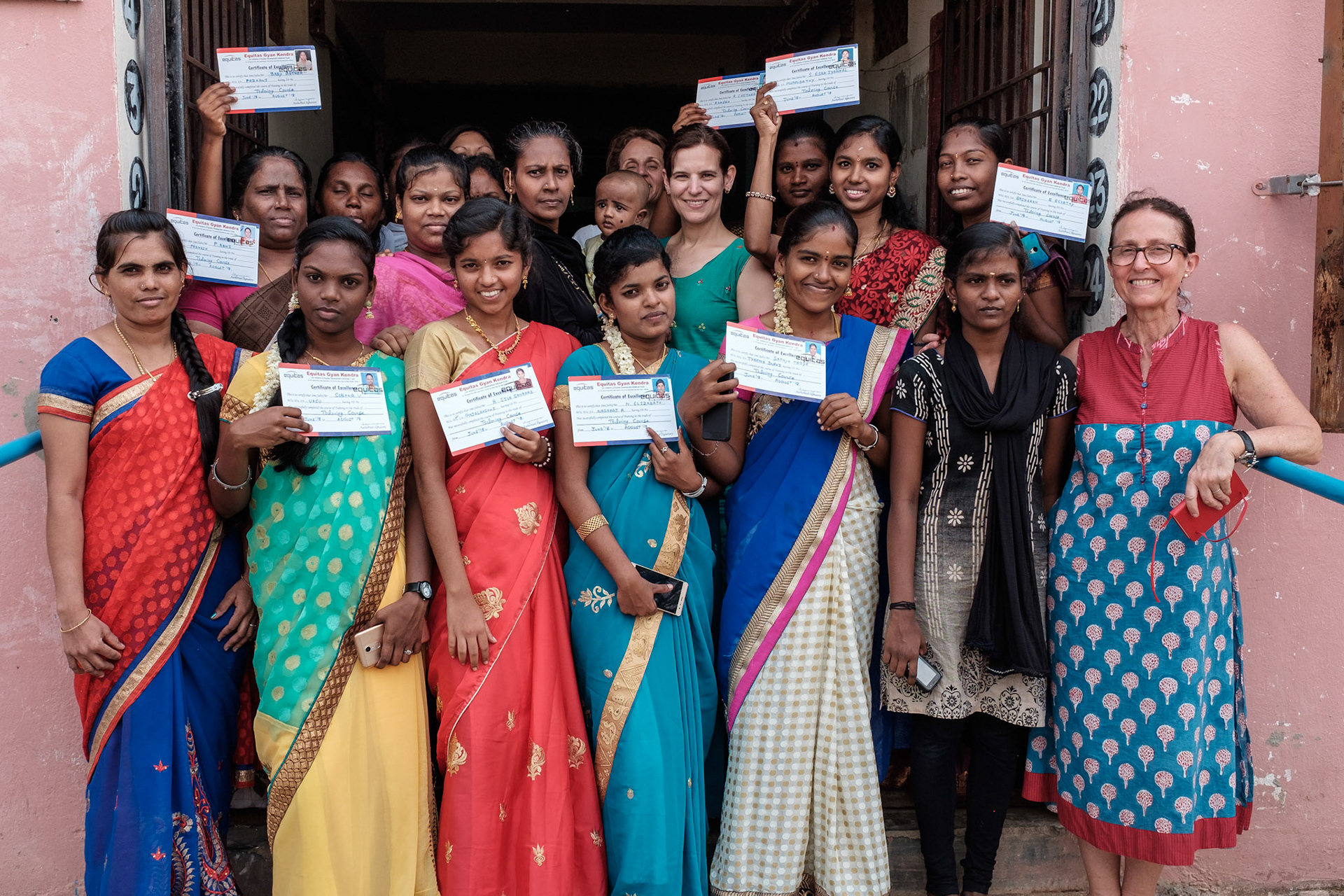 Women from an Equitas sewing skills course at their graduation ceremony.
The women live in a large block of government supplied permanent accomodation. There are enough people here for the courses to be run in the blocks.