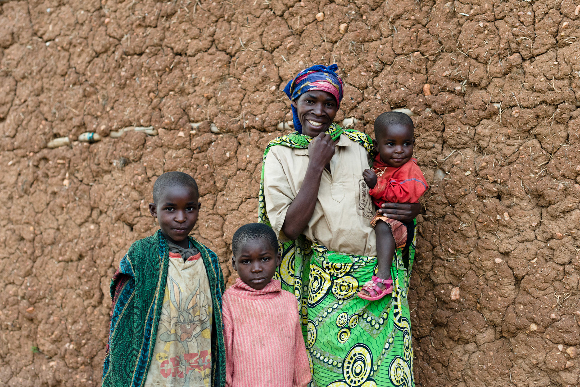 Philomene, 35, with her children (L-R) Ishimwe, 10, Jean de Deui, 7, and Claire, 2.
Philomene's husband Kanan, 32, is rarely around. He leaves very early to find work and often stays away as there is little food at the house.