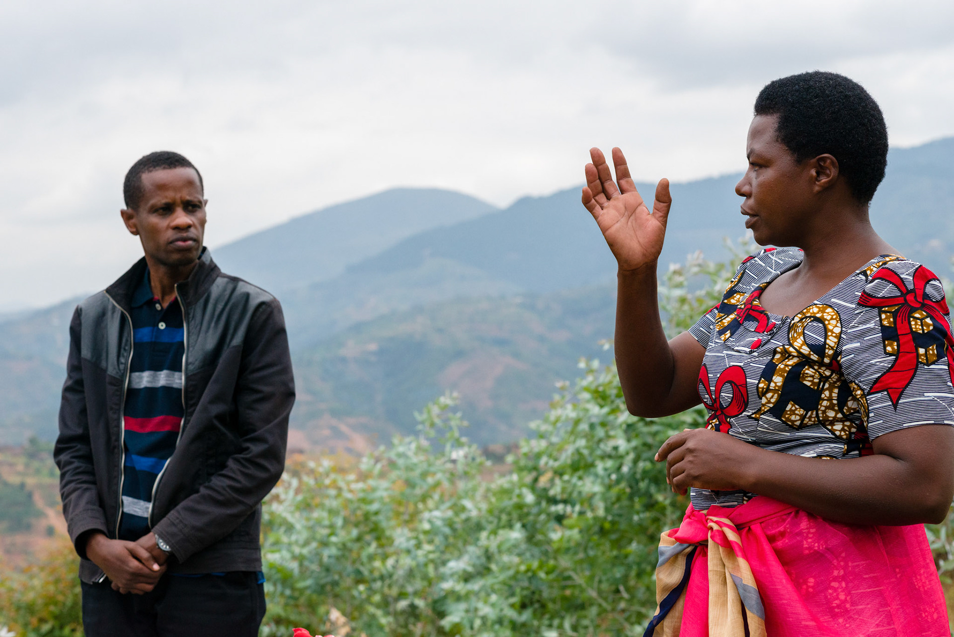 Rose talks about her work as community facilitator with the Kasebuturanyi self-help groups as Wilson, the local NGO field coordinator, listens.