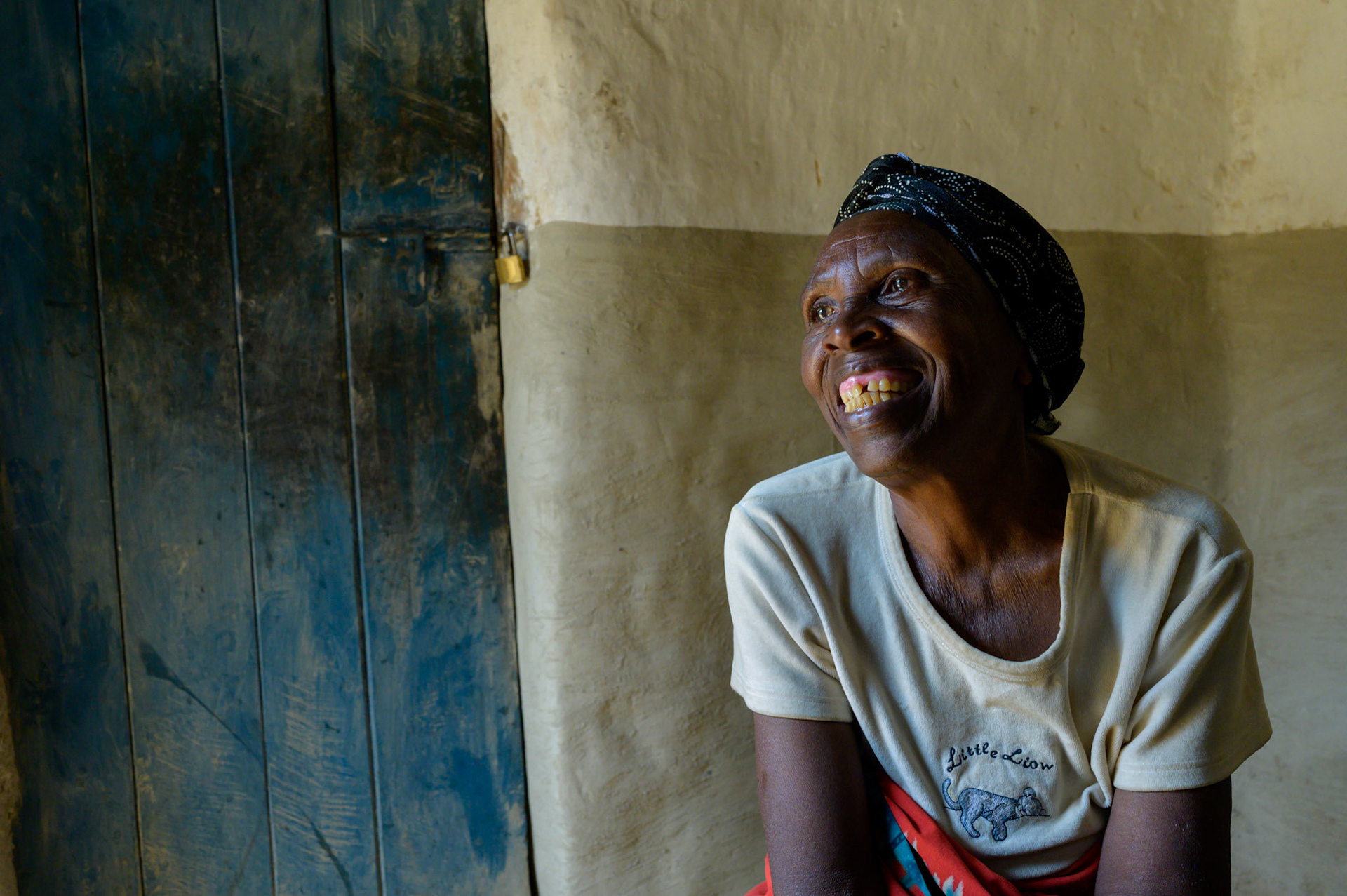 Ancille in her home, a marked contrast to the same photo two years earlier.