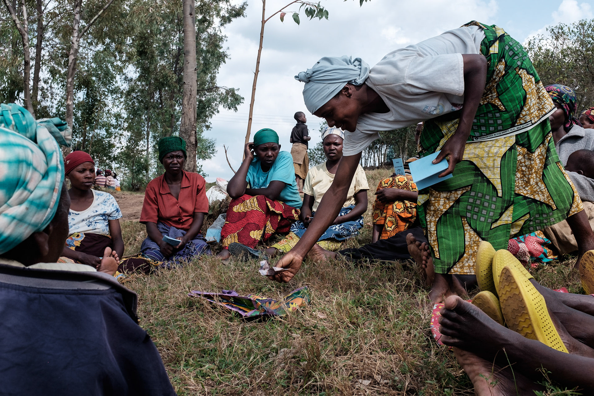 A new self help group meets to put money into group savings for the first time.
The women put money into the centre as their name is called from the roll.