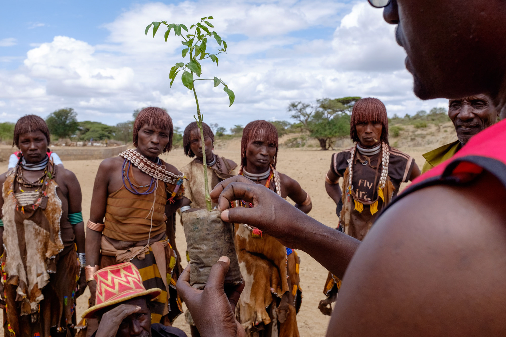 ERCS project coordinator Akna Atana explains the care and cultivation of morninga plants with the Hamer beneficiaries in the Asile kabele, Turni woreda, South Omo