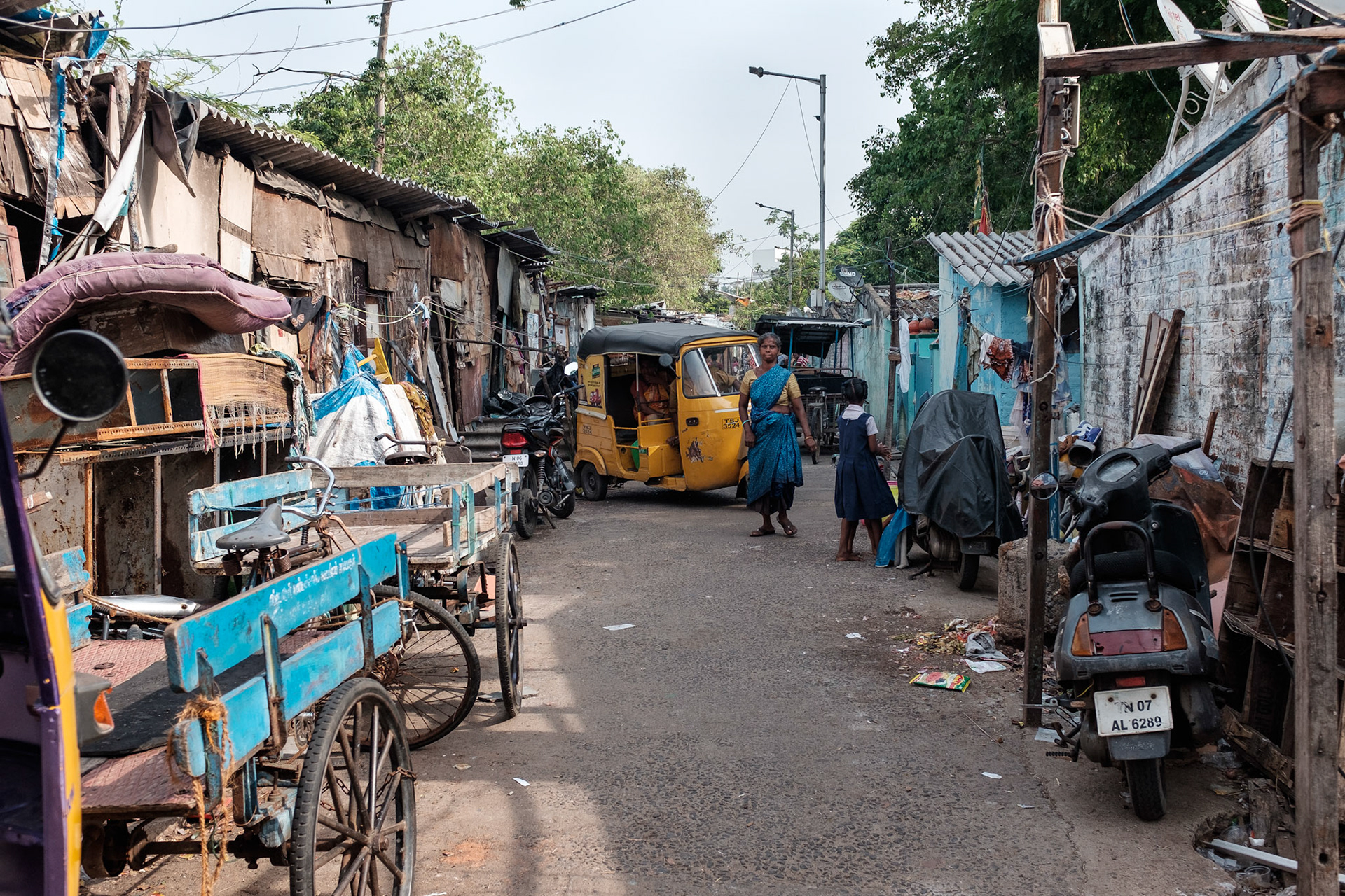 The streets in Pallavan are tight, but still serviced by motorbike taxis and tuk tuks. The settlement has electricity and some water supply.