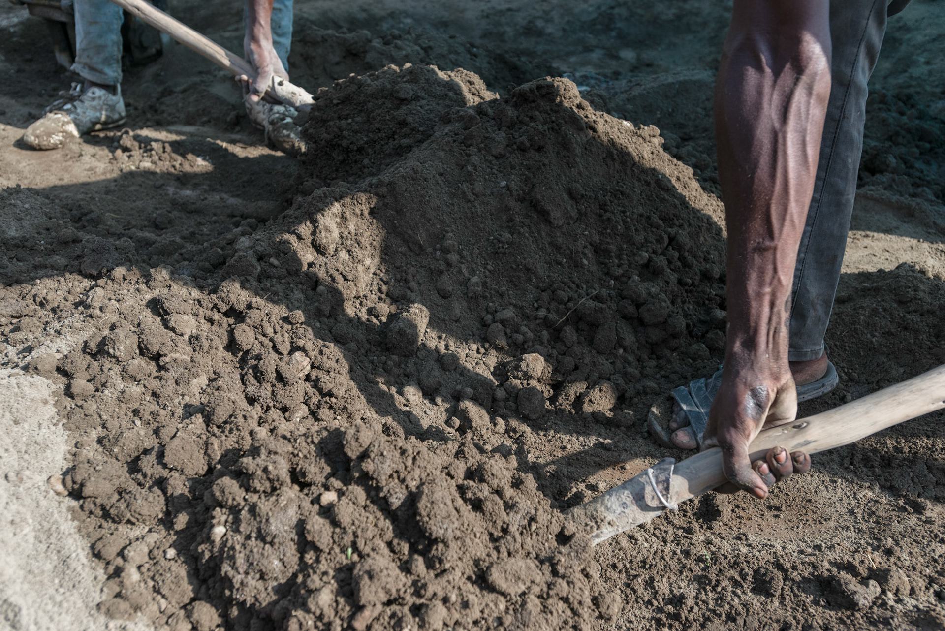 Local men from the Shalla area make bricks to be used in new water tanks.