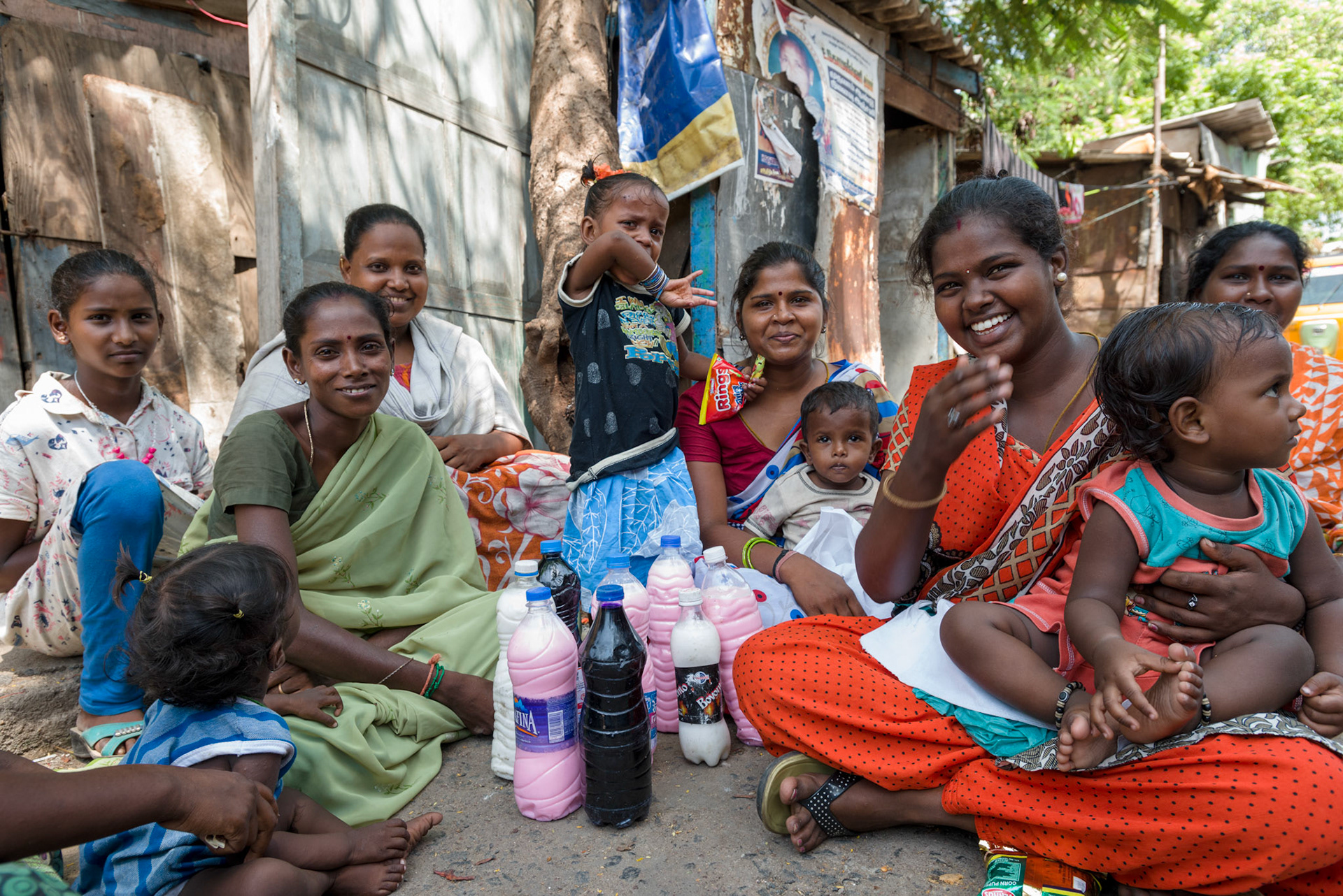 Women in a self-help group meet to collect cleaning products distributed by Equitas.