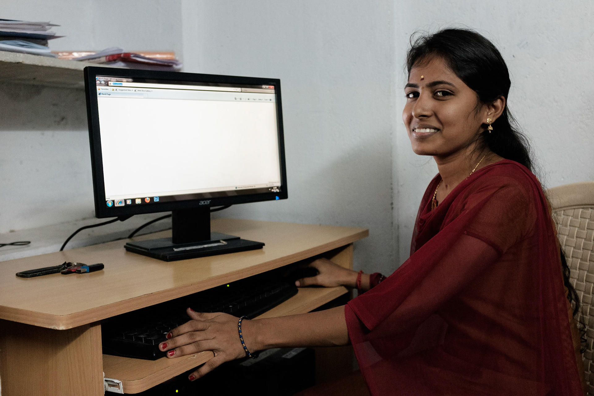 Deepa, 19, is studying for a BS in Botany but has enrolled in the computer skills course to improve her chances of getting a job. She hopes to get an office job after the six-month course.

Before moving to government supplied permanent accomodation her family lived in an unrecognised slum. Deepa says that living here is better. Her father, a stone mason, can get work in many places and the community here is larger.