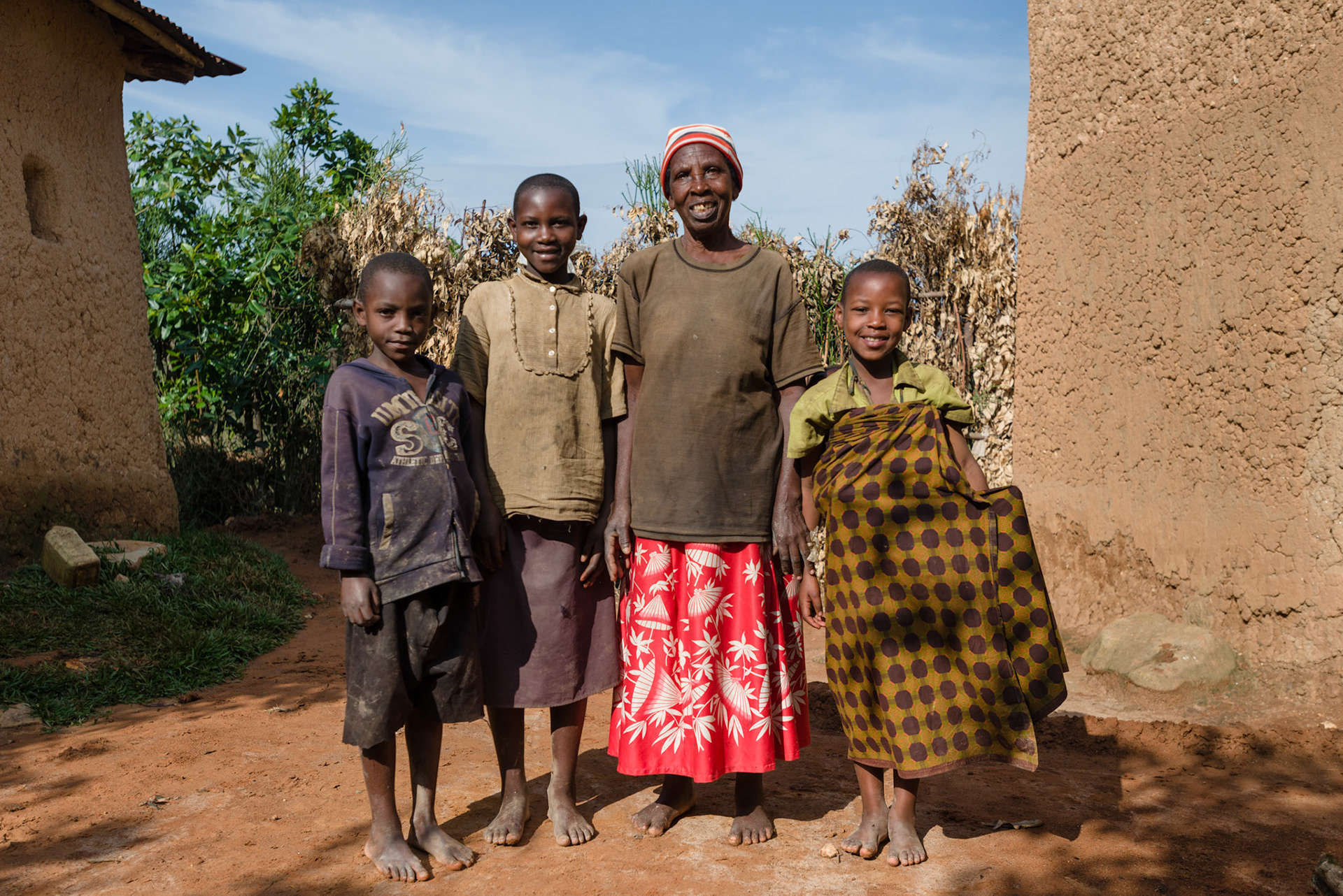 Ancille with her grandchildren (L-R) Valence Nkuruuziza, 7, Denise Tuyizere, 12, Maria Musabyimana, 8, and Rachel Iradukunda, 1 (Maria is carrying Rachel on her back).
Ancille Mukakabana, 71, is has just joined a self help group. She is in poor health, and depends on her children and grand children to provide for her.
Ancille does have easier access to water as this side of the village has a water point nearby.