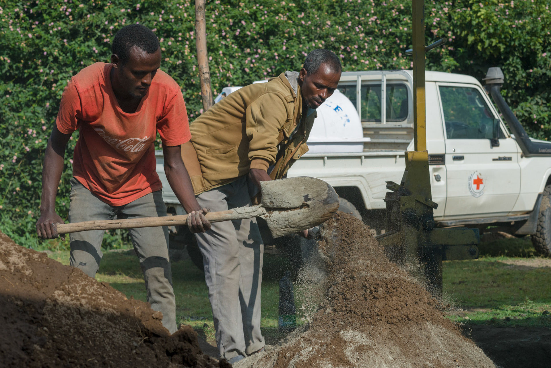 Local men from the Shalla area make bricks to be used in new water tanks.