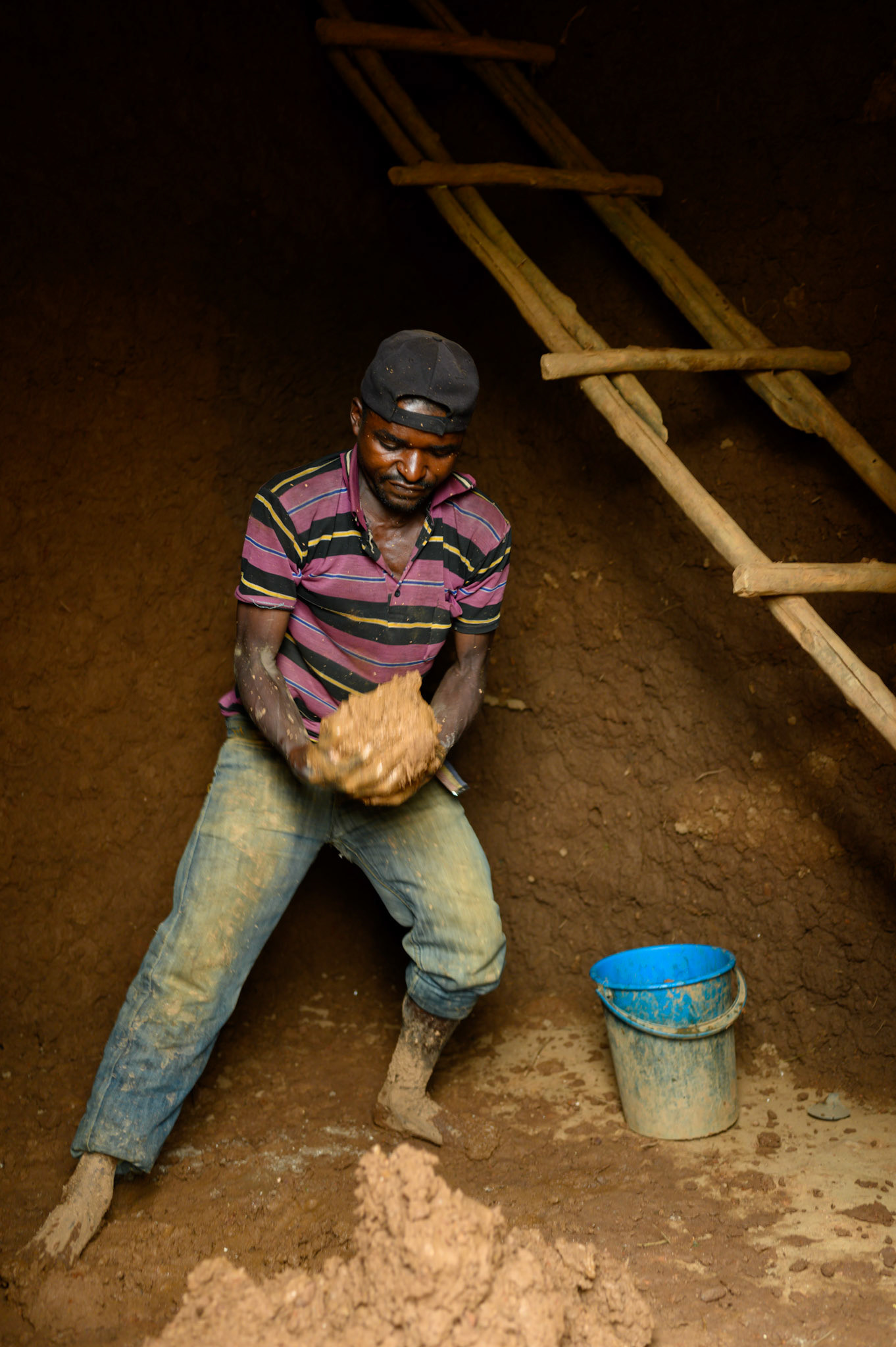 Philomene's husband is renovating their small house.
For many years, Philomene's house has been in need of repair. Her family are now able to do the work on it.