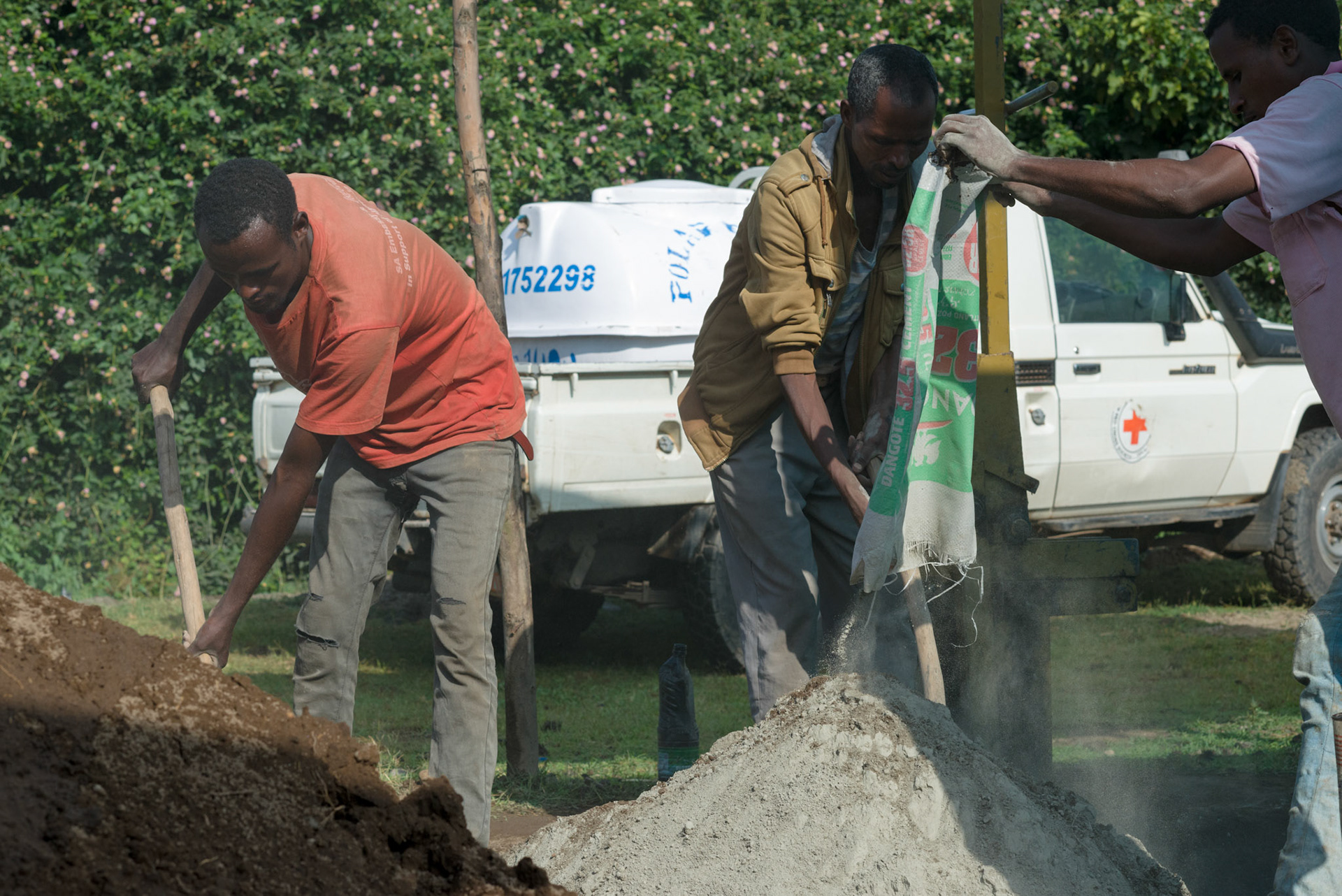 Local men from the Shalla area make bricks to be used in new water tanks.