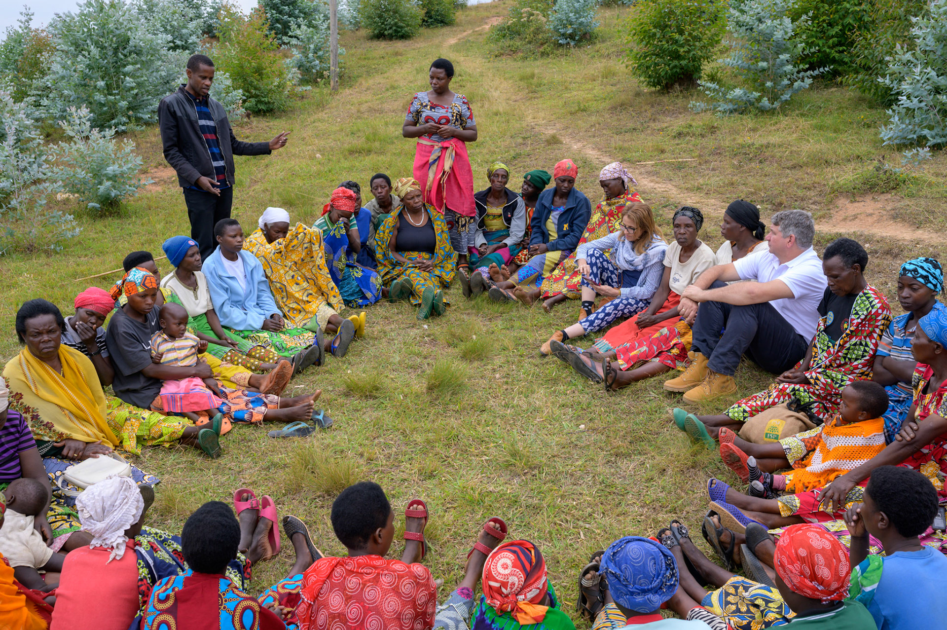 Wilson, the local NGO field coordinator, talks to the assembled self-help groups.