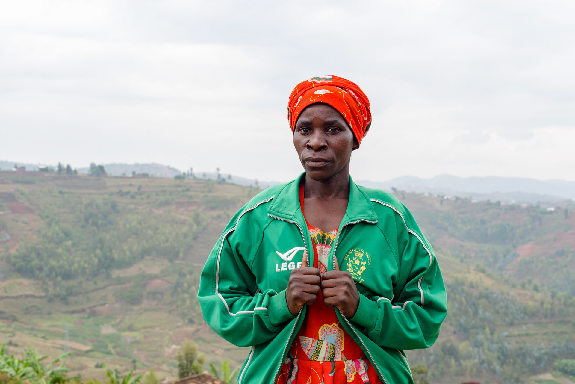 Two years after joining her slef-help group,for the first time in her life, Philomene has bought a newly made dress. The jacket is a second hand import, but she is very proud of it.
She has stopped making clay pots and now sells avocados at market.