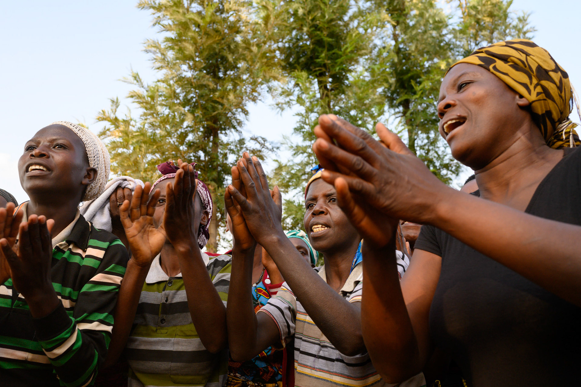 Women of the Bwama self-help groups dance in welcome for the Rawandan NGO that supports their self help groups.