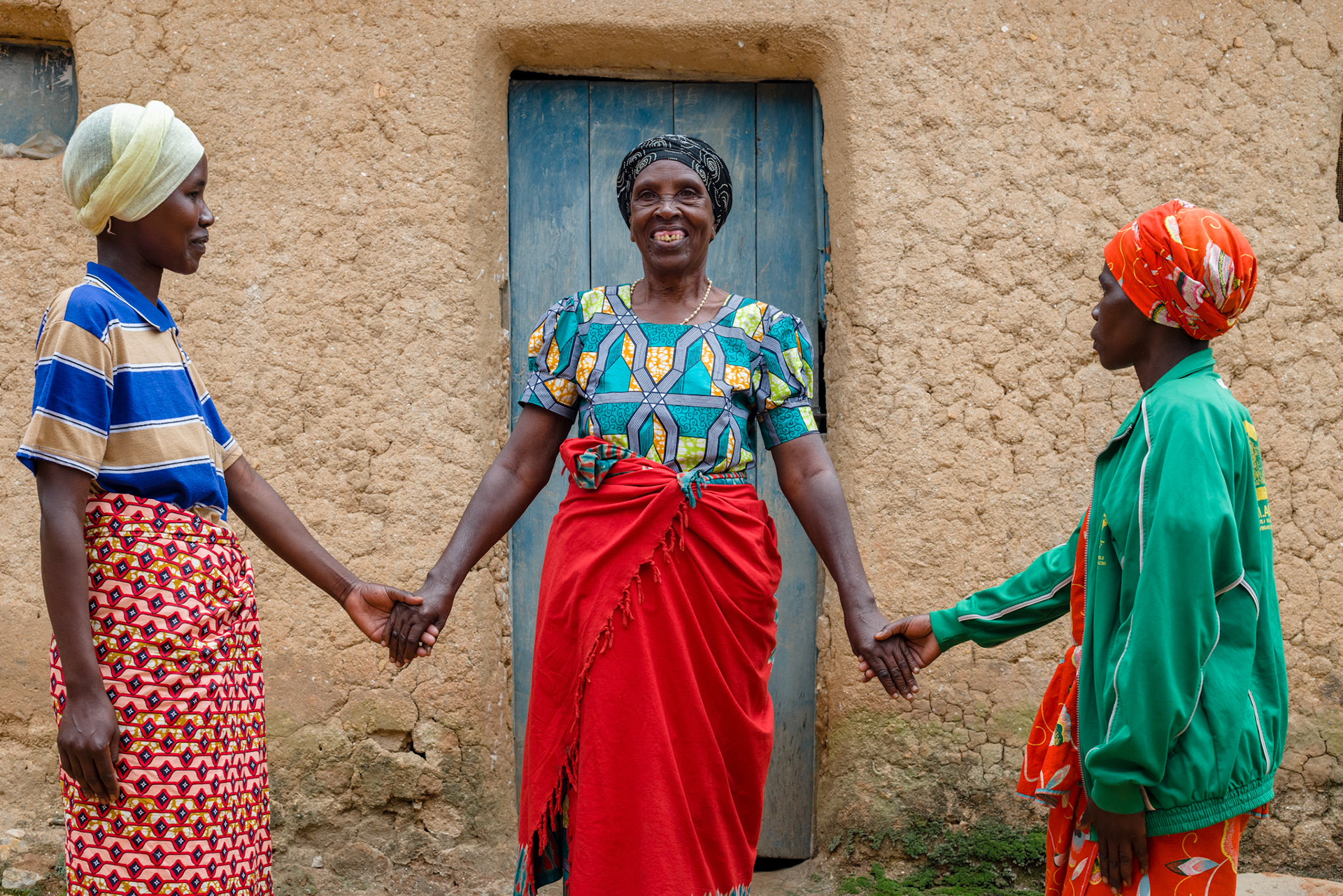 Asked how she would like to portray the way she feels after two years in her self-help group, Ancille had two of her groups members hold her hands.