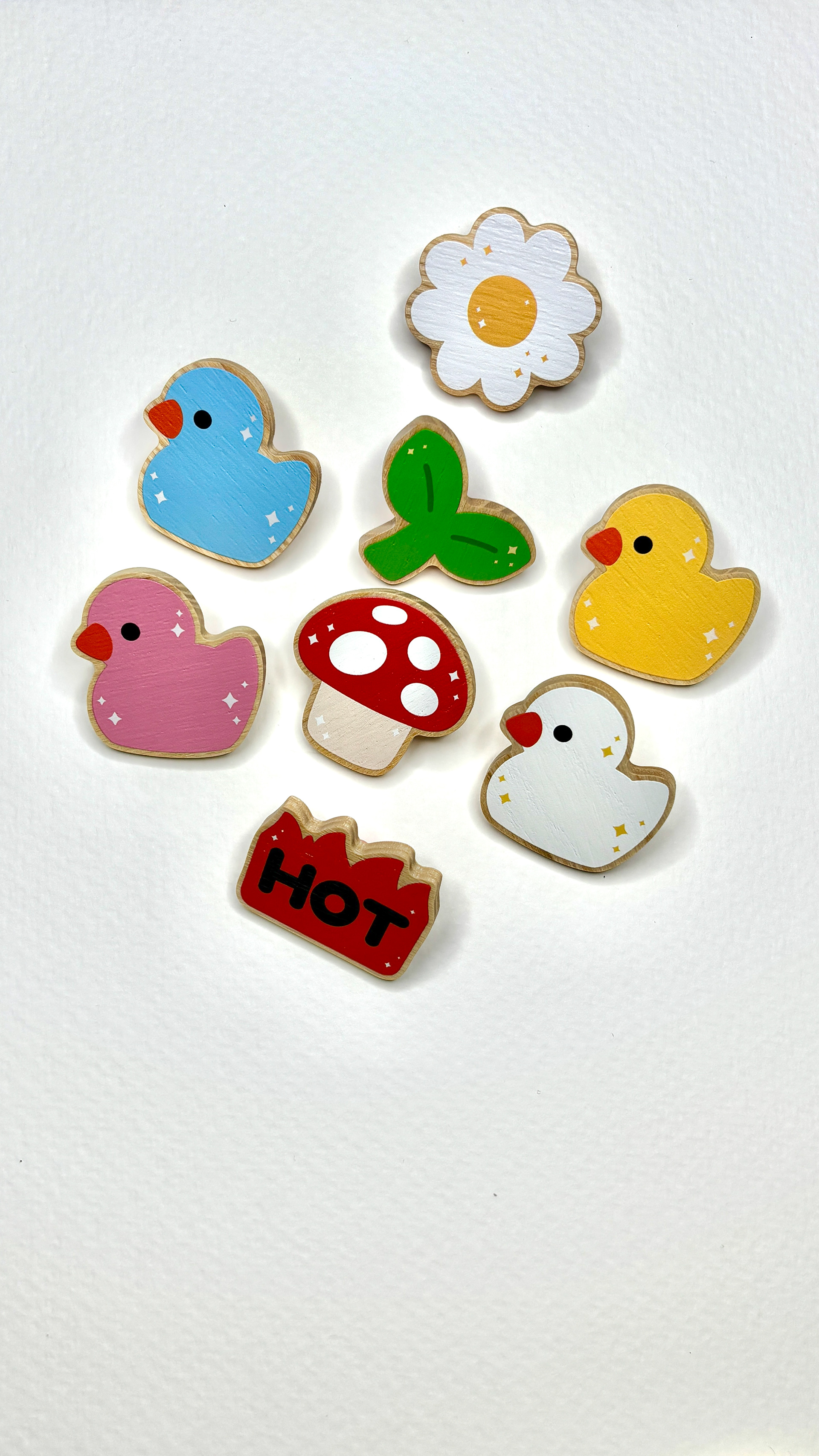 Custom Wooden Pins for Festivals, designed and manufactured @cl.ari3es, conceptualized and sketched by me