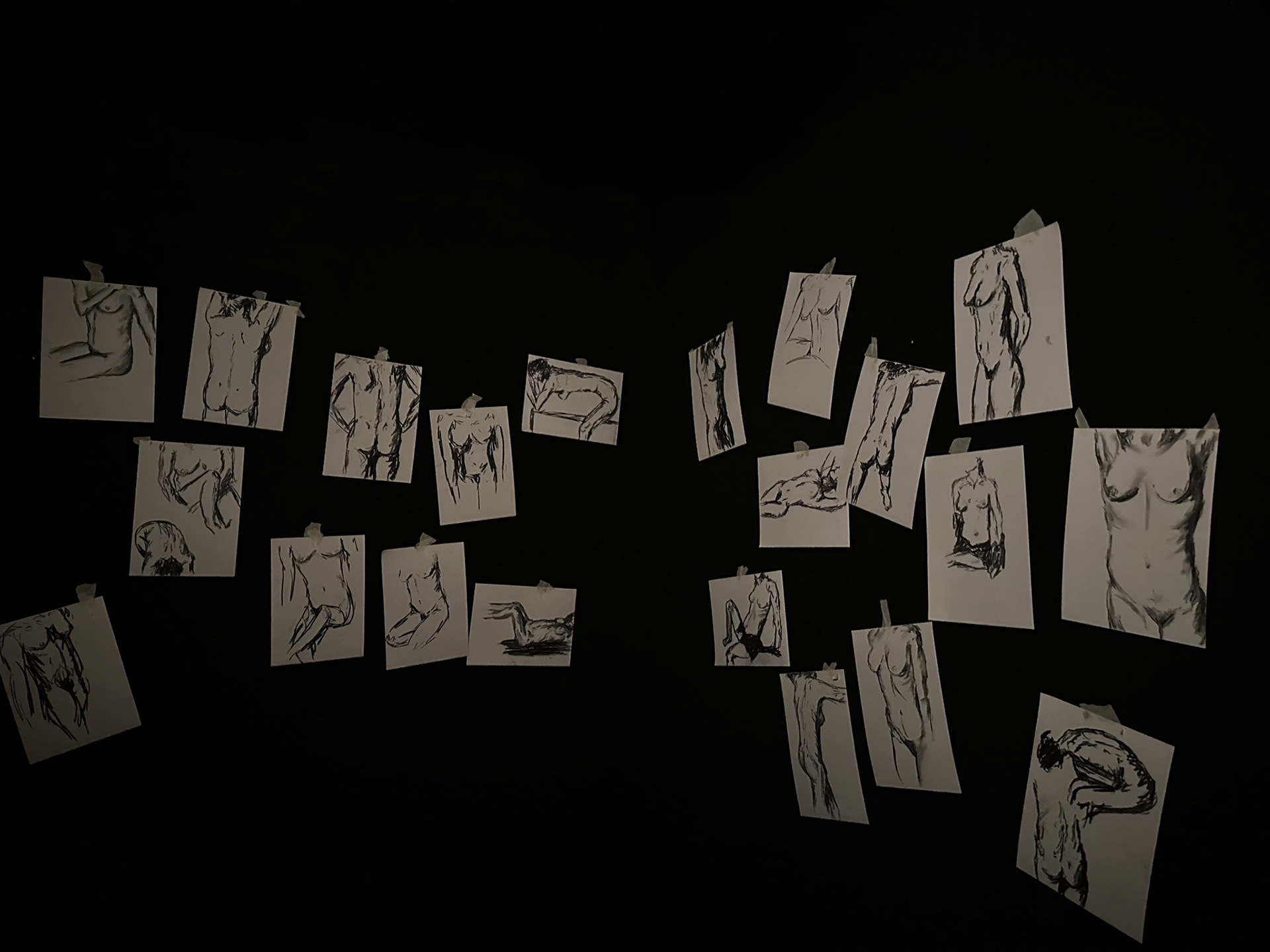 Collection of A4 charcoal drawing made and hung during performance. 