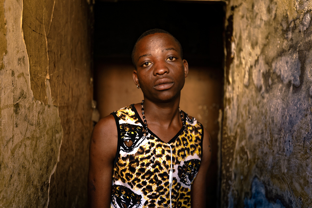 Zimbabwean Boy 2014 - 2016 210gsm Tecco Semi Matte, Face mounted 3mm perspex A1. A young Zimbabwean boy stands for a portrait and tells me how he thought he was going to be rich in Johannesburg. He had left to Johannesburg without his mothers consent and now wanted only to return home. Many immigrants told me of how they expected to earn a lot of money in Johannesburg and be able to send money home to their families but in reality were struggling just to survive.