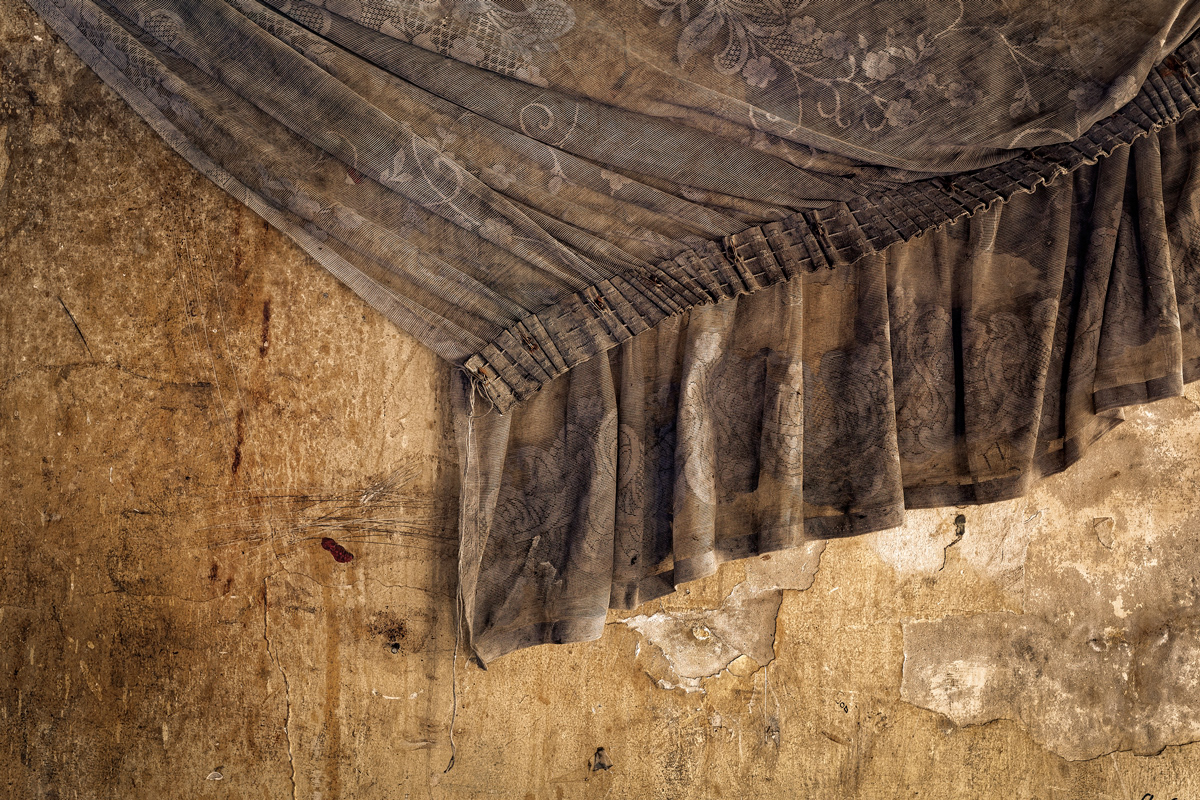 Curtain 2014 - 2016 Photographic Print Fine Art Cotton Fibre A0. A curtain hanging against a decaying wall in Dark City portrays the desire of a home even in the most undesirable living conditions.Many people call Dark Buildings home as there can be very little other choice available.