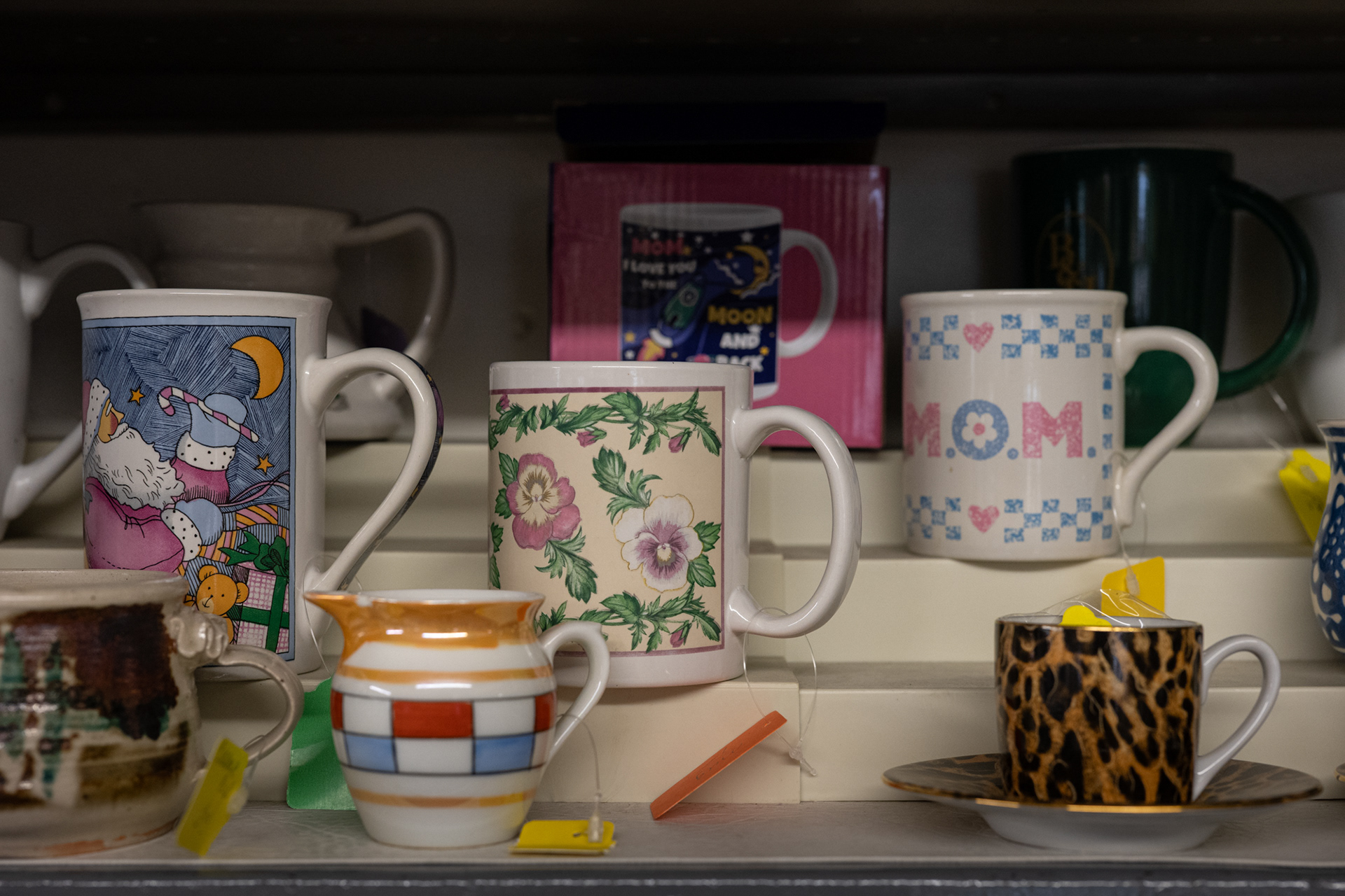 The store is open to all types of donations from clothing to kitchen items, including a collection of donated mugs for sale. 