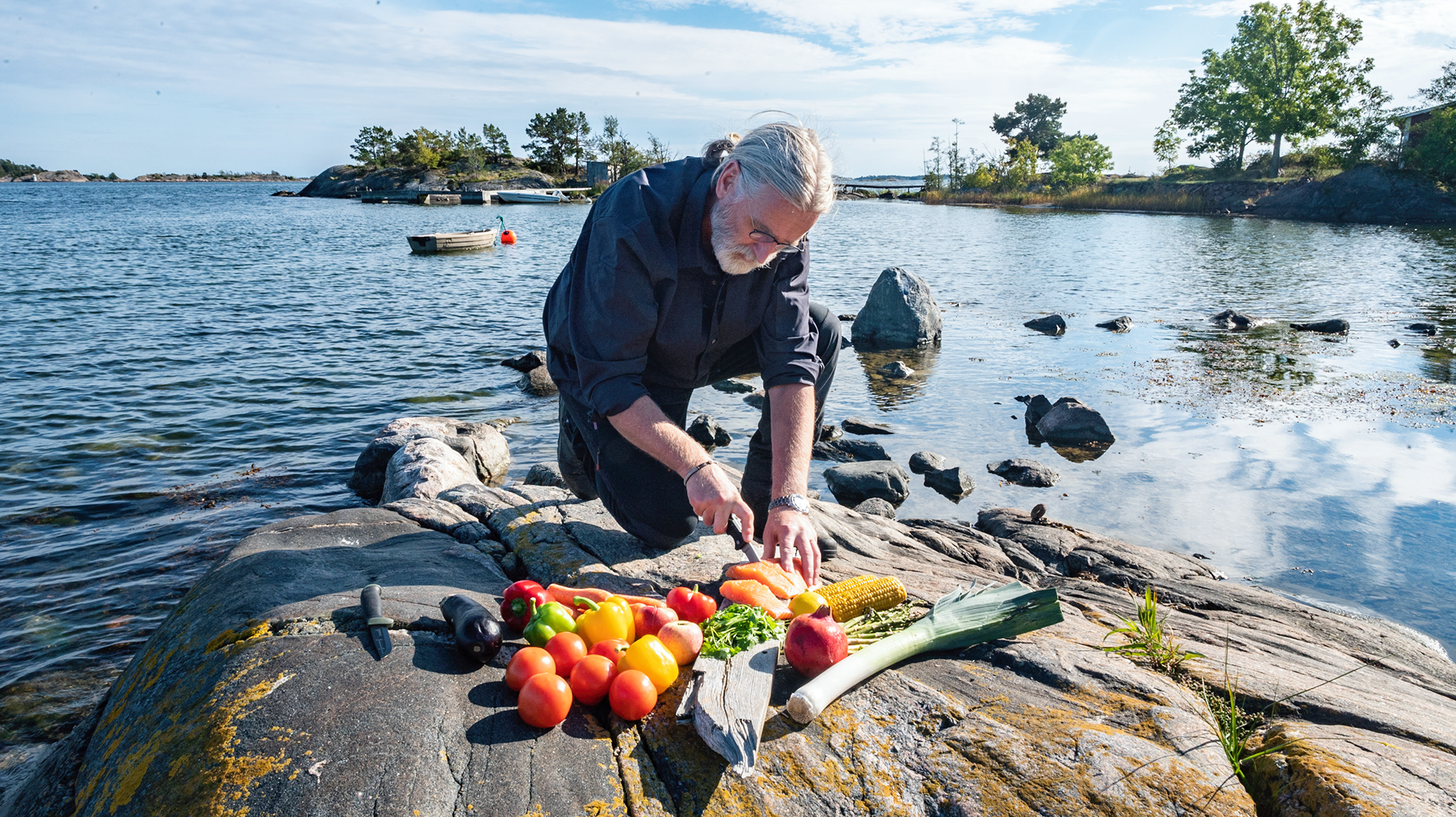 Erik Wallgren preparing salmon and vegetable packets.