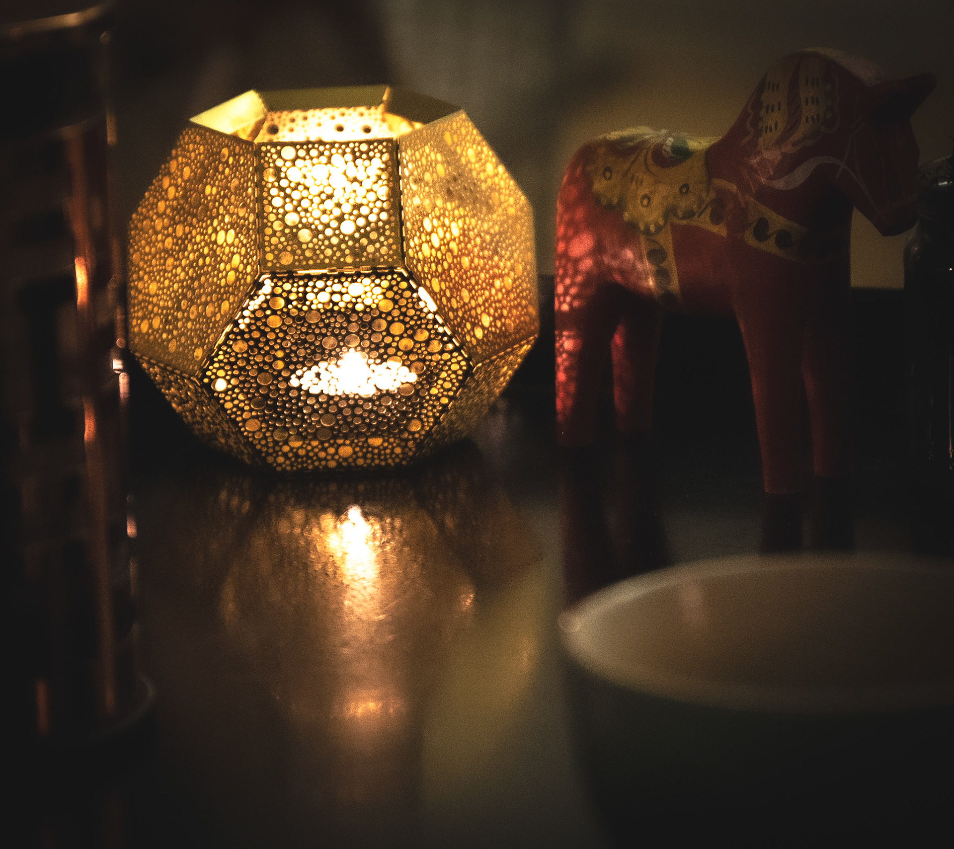 Candles are lit throughout the house during the long nights of winter.