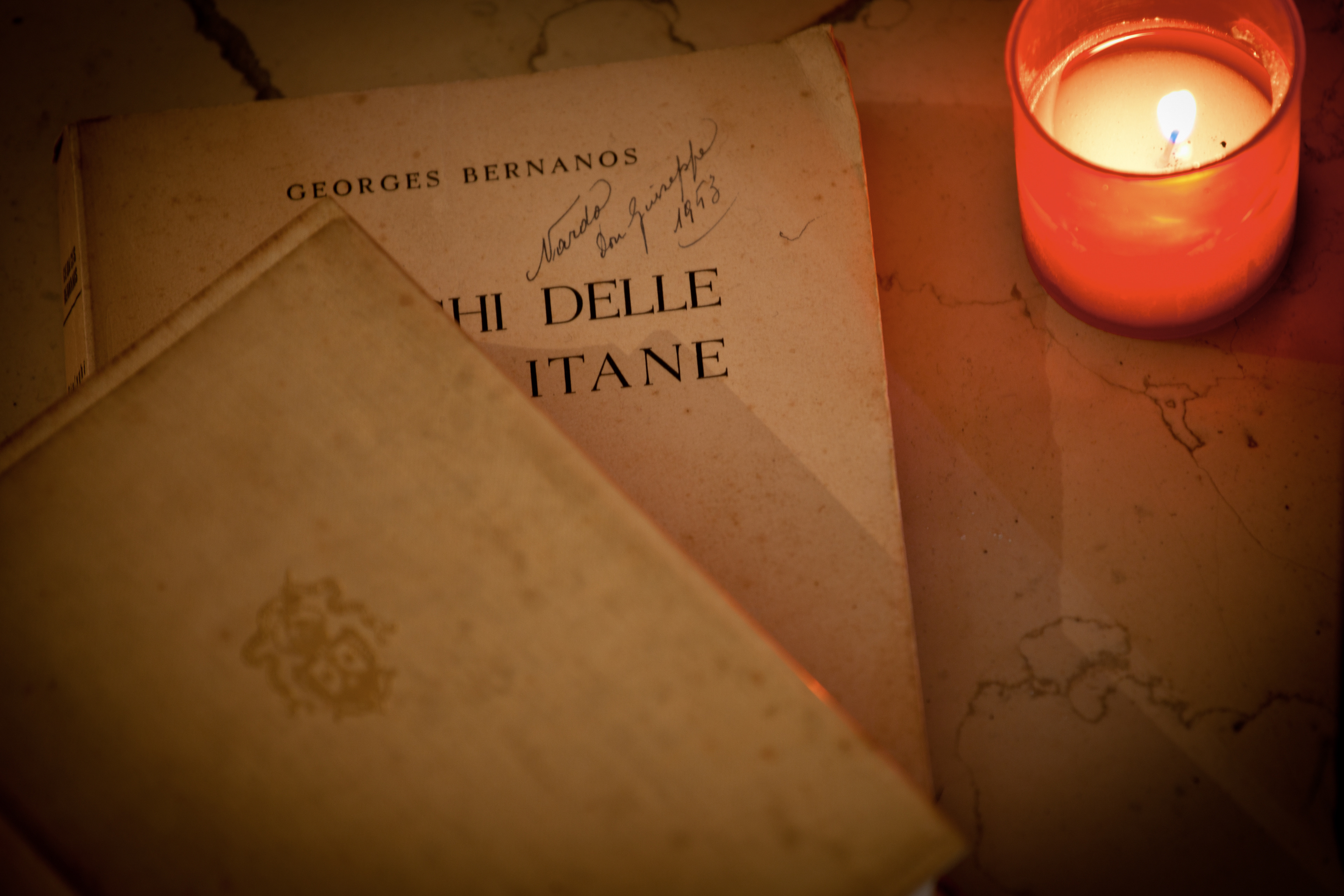 detail of a vintage book by Georges Bernanos near the Hermit's bed