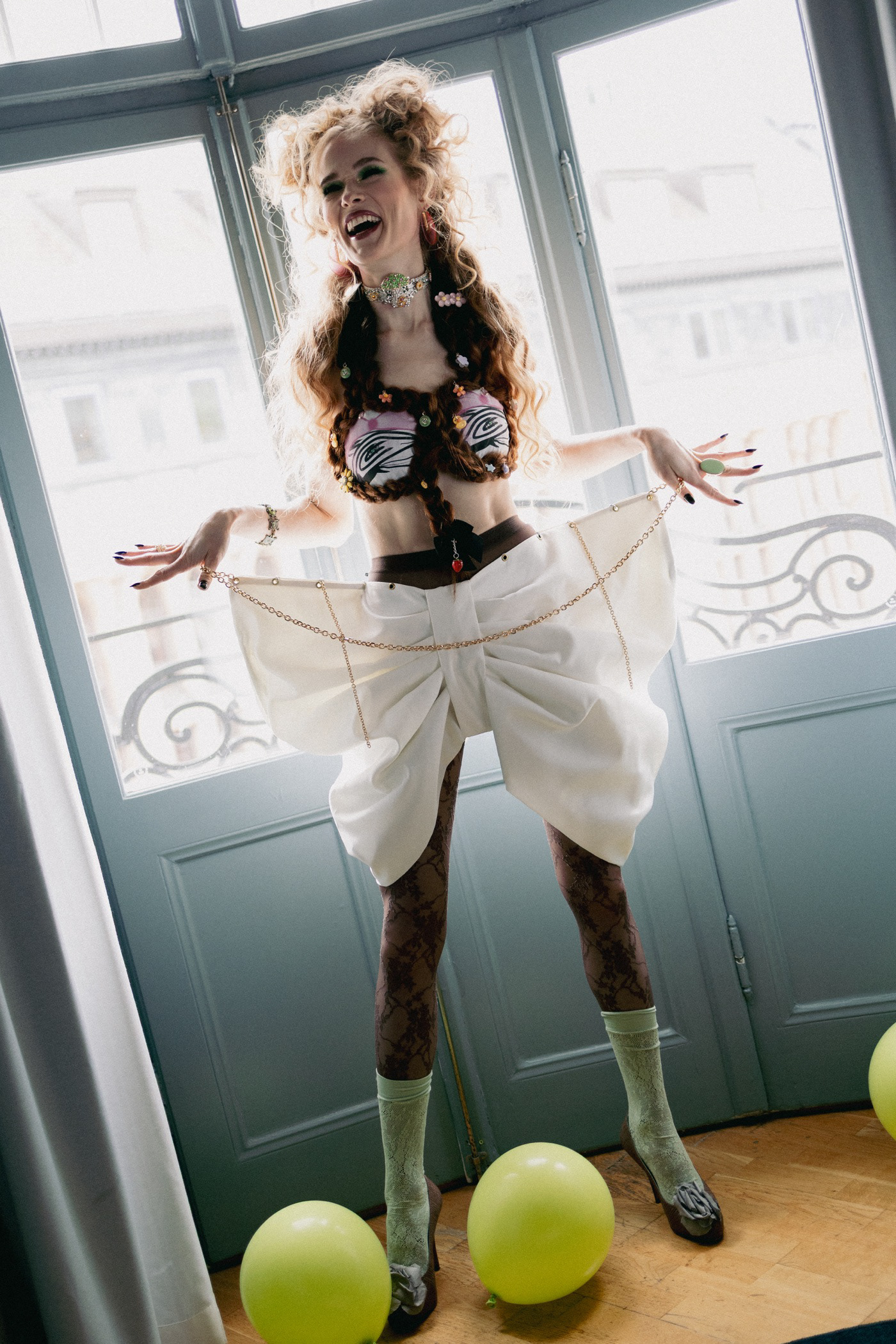 Sasha Sytenko — white tailoring and expressive fashion styling.