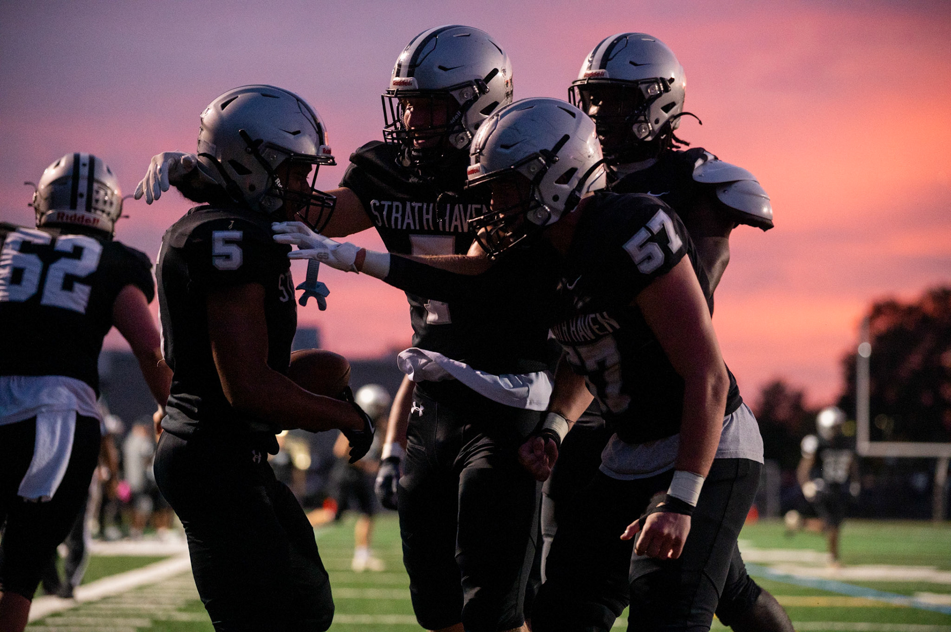 The varsity football team celebrates after a touchdown on Sept. 26.