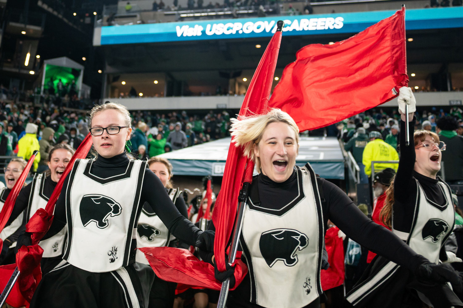 Band front members storm the Lincoln Financial Field on Nov. 16