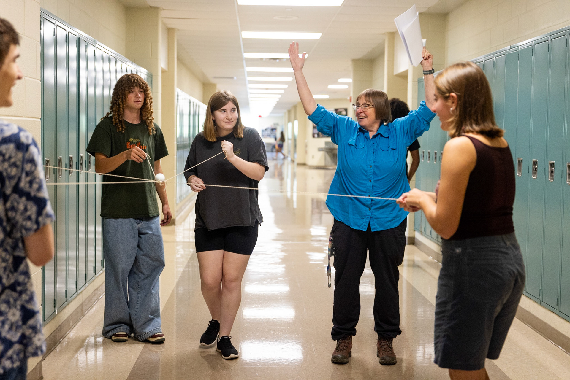 AP Environmental Science students walk through the halls as they balance a golf ball, avoiding Ms. Katie Shepard (blue shirt) as an obstacle on Aug. 25, 2025.