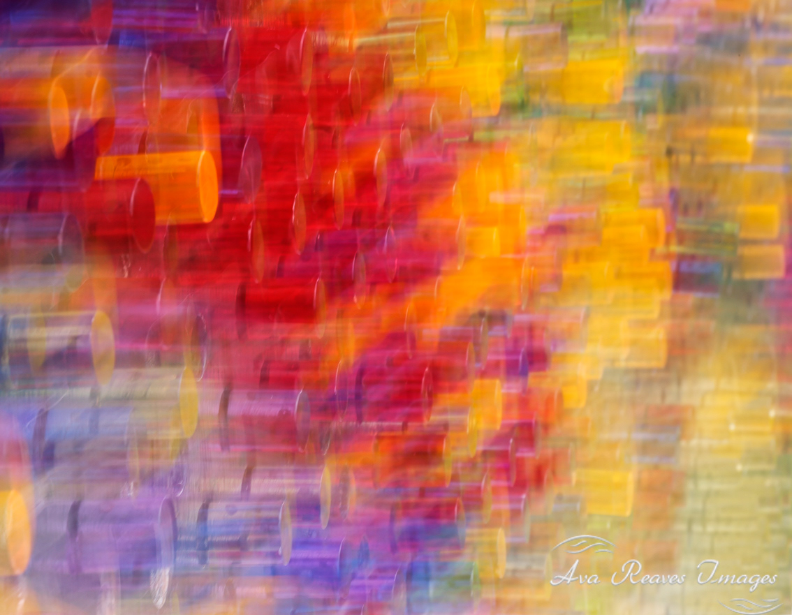 Colorful round LED lights in a sign at the Maymont Garden Glow in Richmond, Virginia. I've used intentional camera movement to create this abstract.