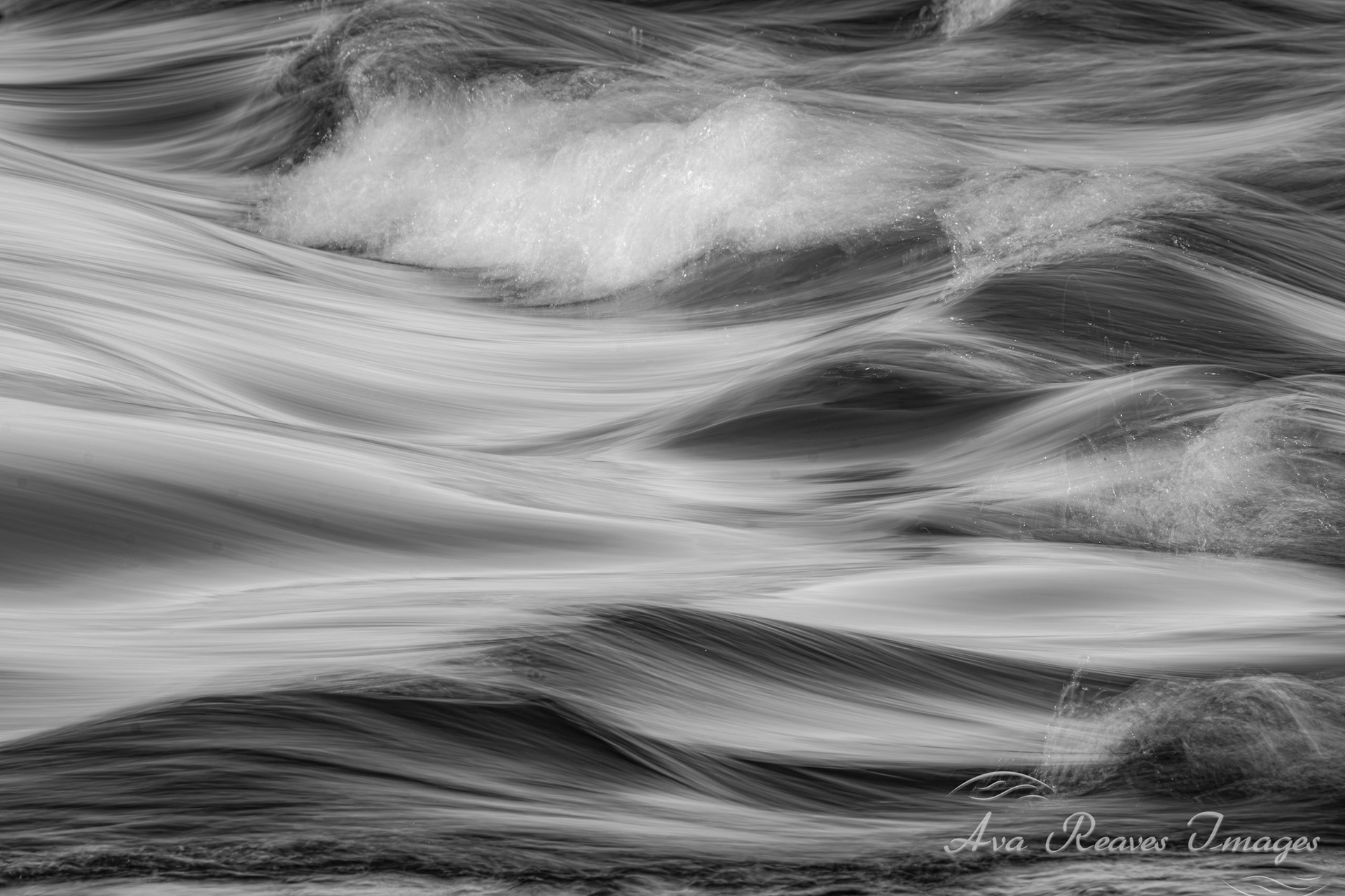 black and white long exposure rushing james river at pony pasture