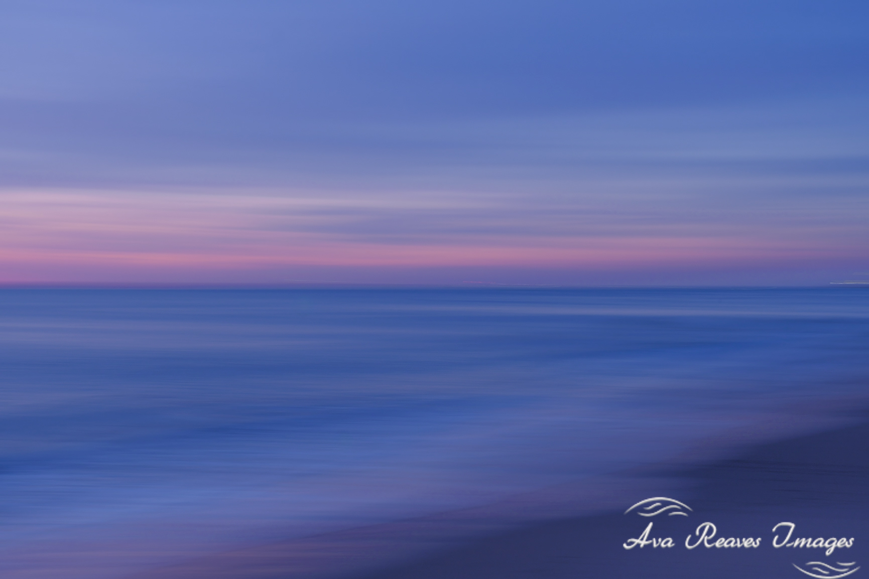 An intentional camera movement (ICM) photograph of a sunrise over the Atlantic Ocean, featuring abstract blues, purples, and pinks