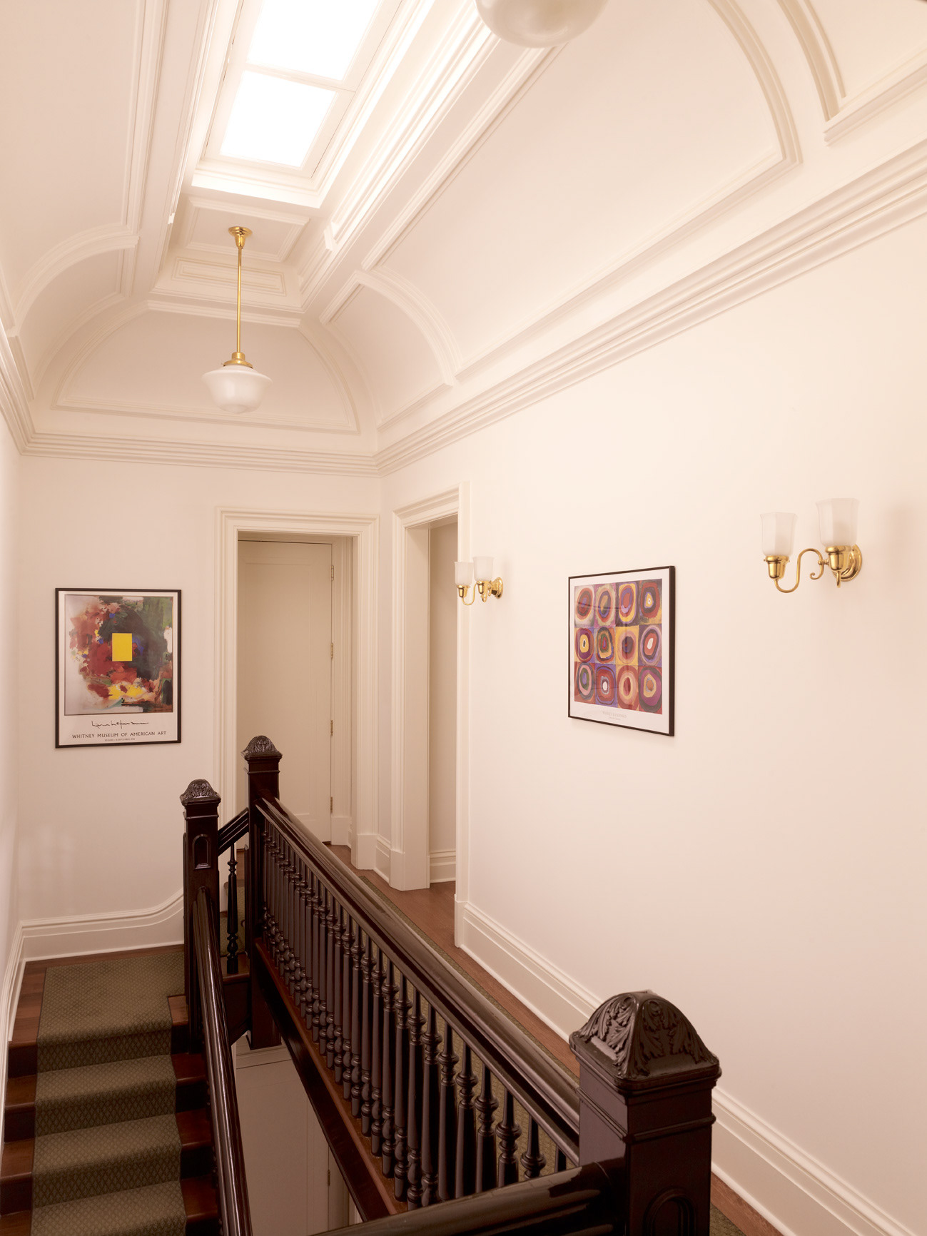 Renovated stair paneled skylight in a restored NYC townhouse.