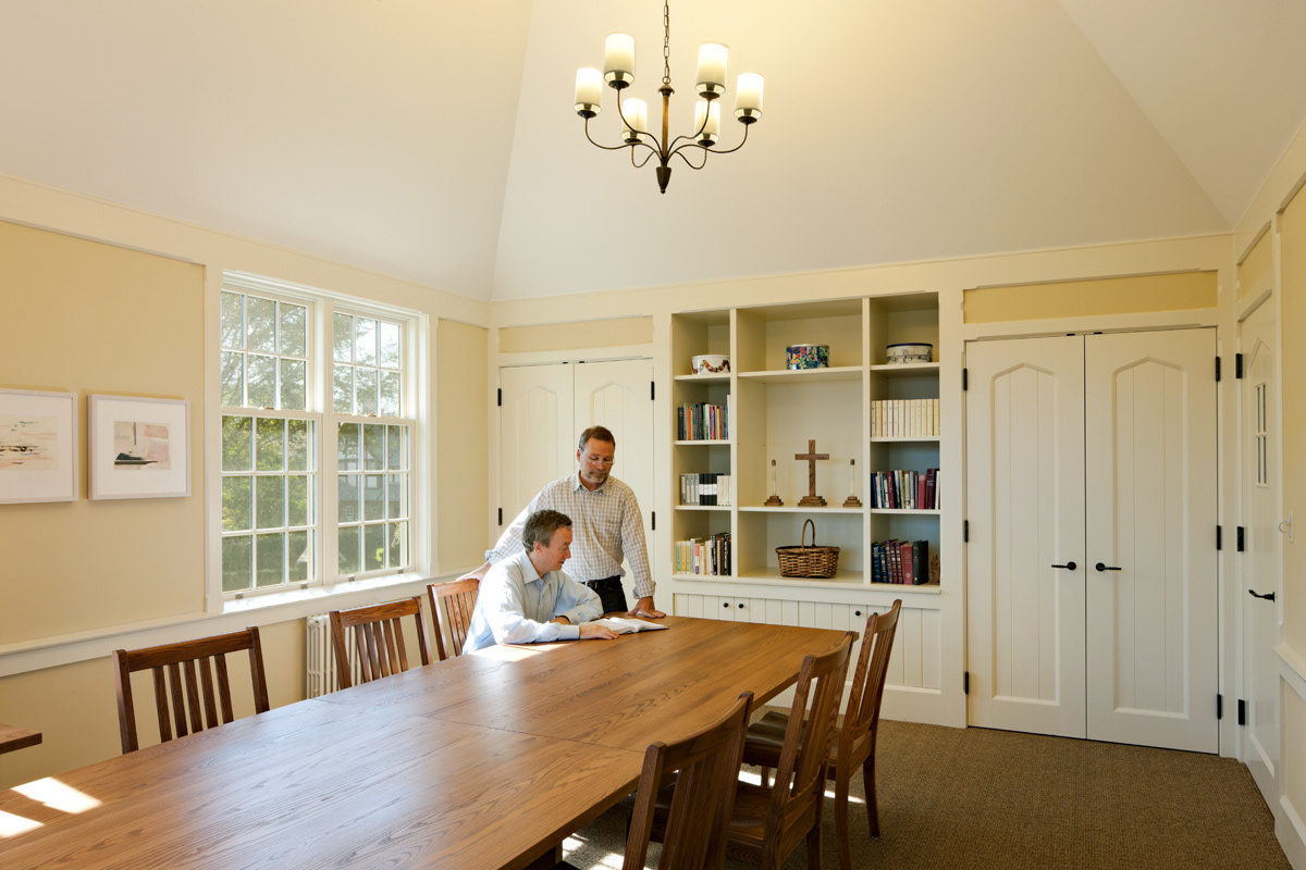 Parish Hall classroom with high tray ceilings, 6 over 9 double hung windows and gothic arch closet doors.