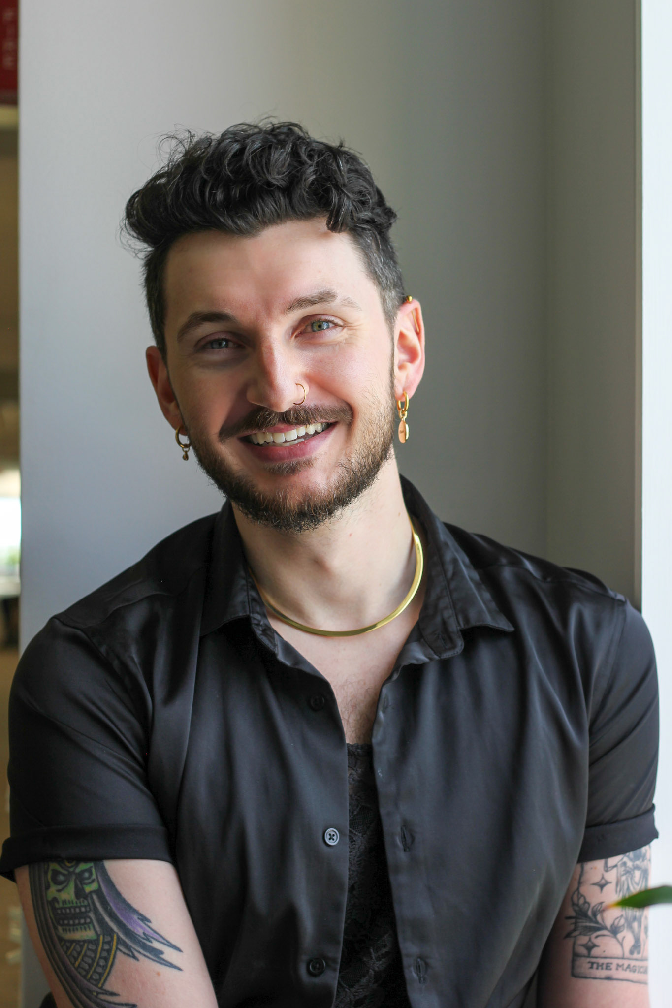 Dimitri, He/They . “What does it mean to be male? This is something I used to ask myself. Several years ago my spouse came out as nonbinary, so I became fixated on words like ‘masculine’ and ‘feminine’; I questioned them and used them cautiously. What was I trying to say instead: kind, strong, empathetic? There was always a more truthful word. Doing this brought me to realize I did not identify with the common cultural idea of a masculine person. I removed a box society placed me into, realizing I was greater than the space that held me. I can be beautiful, tender, brave, I can be anything — I can be myself. Who I am doesn’t line up with what I’m told a CIS male looks like, and that’s okay! Don’t let this world put you in a box, because you cannot be contained or defined.  I have come to love the word queer. It allows me to declare that I don’t quite fit in with the CIS gender straight box of society, but I don’t have to plant my flag in any other constricting boxes, either. I am allowed a semblence of fluidity. Am I nonbinary? Pansexual? Polyamorous? I am just Dimitri!”