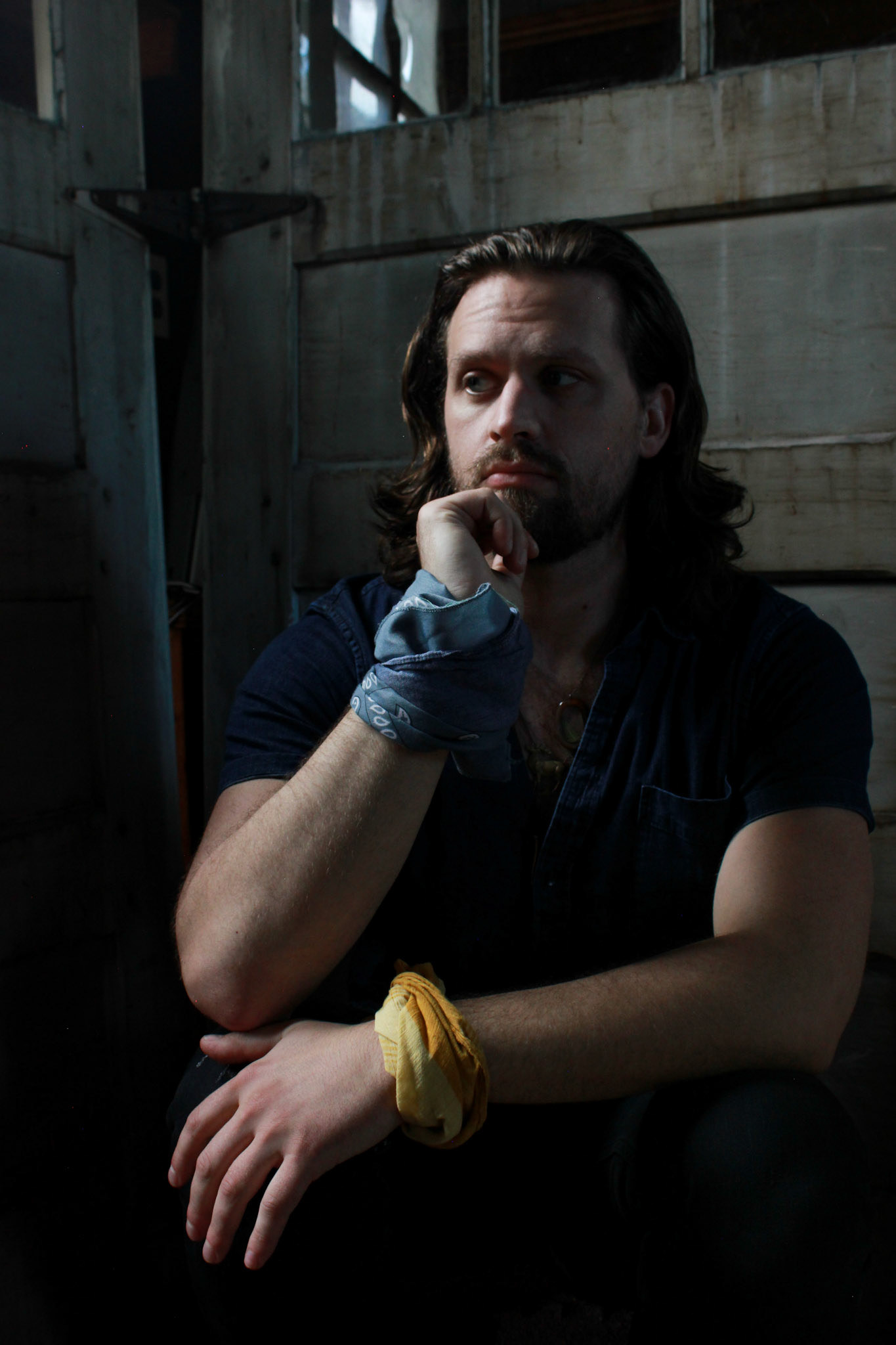 James, They/Them . “When Kyle Warnock agreed to be involved in my upcoming photo series and asked me to be involved with his in return, I was thrilled. As two very different photographers both primarily photographing queer subjects in very different ways, our meeting in real life had been quite overdue. However, I was NOT prepared for this photoshoot. I had misunderstood the plans we made and thought that ~I~ would be shooting ~him~ on this day. Not the other way around. I'm happy that's what happened though, because I think not having put myself in the headspace of ""I'm being photographed today"" until moments beforehand added an extra layer of vulnerability to shoot that might not have been there otherwise. For me, so much of the portraiture I do is about finding beauty, power, and authenticity in those moments of vulnerability. I'm delighted with the sides of me Kyle witnessed: someone who is often a little bit flustered, typically a little bit self conscious, and usually a lot bit goofy.”