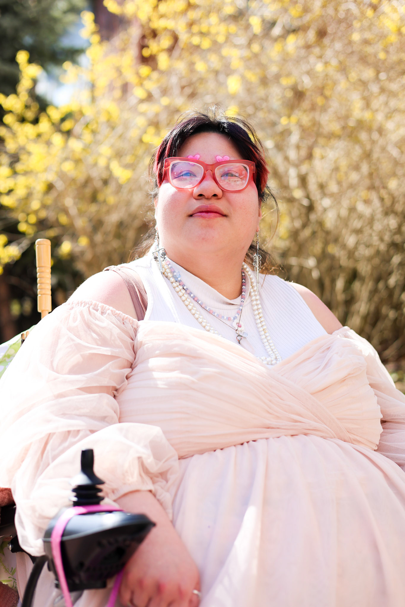 Donovan they/them it/its, ask them! Donovan is a genderfluid disabled artist who has been exploring their relationship to their own queerness in many ways since their schooling days. They value being their authentic self and emphasize this in their forms of expression, from makeup, to fashion, to art. Bright colors, especially pink are among the favorites that fill an overflowing wardrobe, from pastels to goth pieces. For someone who considers themselves "genderhoarder" the ability to shapeshift in outward gender expression can be a very freeing and euphoric experience, allowing one to settle into feeling like oneself. Donovan is also particularly fond of exploring somewhat surreal artistry, finding interest in new mediums, bold colors, and sometimes difficult subjects. Art expression was perhaps Donovan's first love, and is a way for them to connect with the world, difficult emotions, big emotions, and more. Navigating the world as a queer disabled person of color can be a whirlwind sometimes, but finding the ability to be authentically themselves, and express themselves as fully as possible will always be Donovan's goal. They hope others can also find the ways that feel best for them to be as fully themselves as possible as well. 