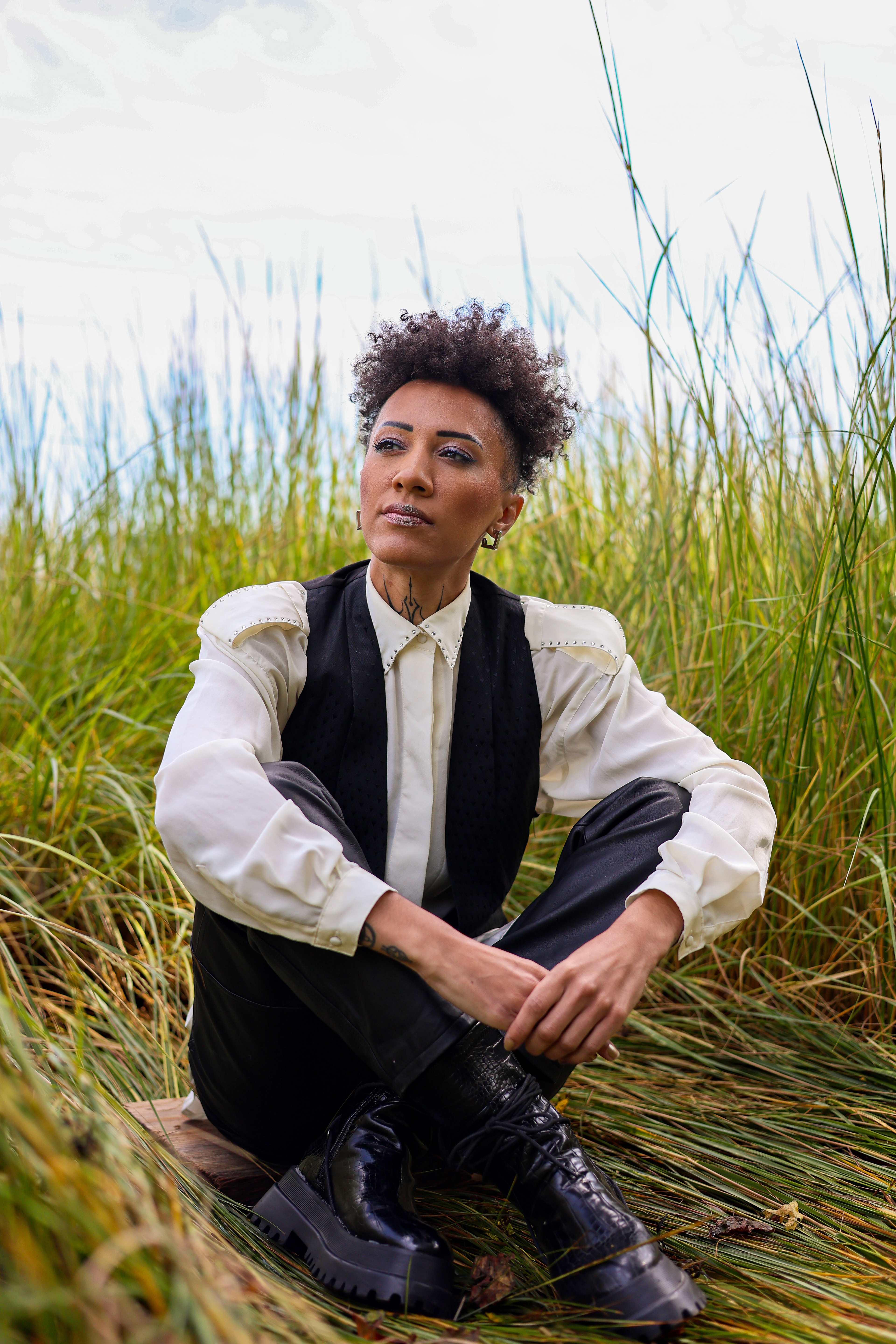 Aquarius, They/Them . “Portland has been the site of deep transformations and catalysts that have formed me into the artist that I am. I continue to experience divine reflections of my place here, and how I can have an impact on the communities that shaped me. Being from Maine and having strong roots here, I have entered a season of harvest while simultaneously planting seeds for my future. I want to continue building creative & liberation based spaces in this state, especially for Black, Brown, Indigenous and Immigrant people, and I see this as a part of my life’s work.  I returned to Maine in November 2024 after spending a majority of the previous 9 years in Mexico. That spiritual journey conditioned and prepared me for what is happening in the current moment, both personally and on a collective level. I came back to my home state to be in community, to build systems of care and reciprocity, and to be an example of how to live in possibility while holding multiple and sometimes conflicting truths.  It is my purpose to be a builder of worlds, a bridge between all of the simultaneous transitions, deaths and rebirths we are experiencing collectively. I am here to do liberation work, culture building, healing artistry, and to develop creative capital for groups that have been marginalized and under-resourced – queer, trans, gender expansive people, and people of the Global Majority. Maine has long been known as a creative hub and a place where the arts are celebrated. I believe this is the time to use creativity to build the world we deserve, one that puts humanity first, and is based in regenerative values. So that we can move towards right relationship with ourselves, the land, history, nature, and each other.”