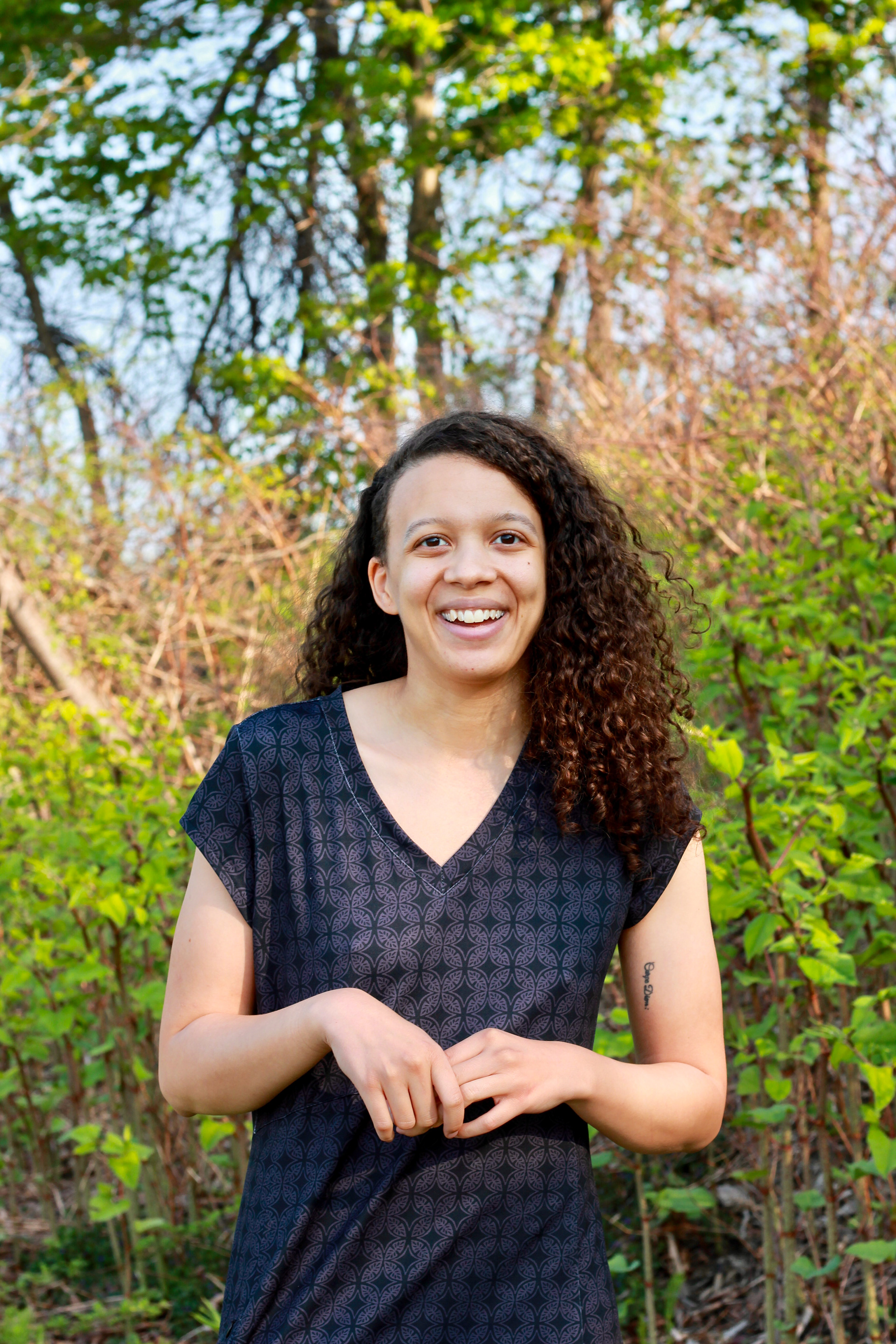 Maya, Ey/They/She . “I'm very grateful for the chosen family and the community I have built here since moving to Maine almost six years ago at the time of these photos. I'm very grateful for my first poetry collection coming out via @gameoverbooks, Judas & Suicide. I'm very grateful for continuing to choose to stay alive. Thank you, Kyle, for these photos and for the chosen family and community you have built in this series. Thank you for taking my photos again. :) <3”