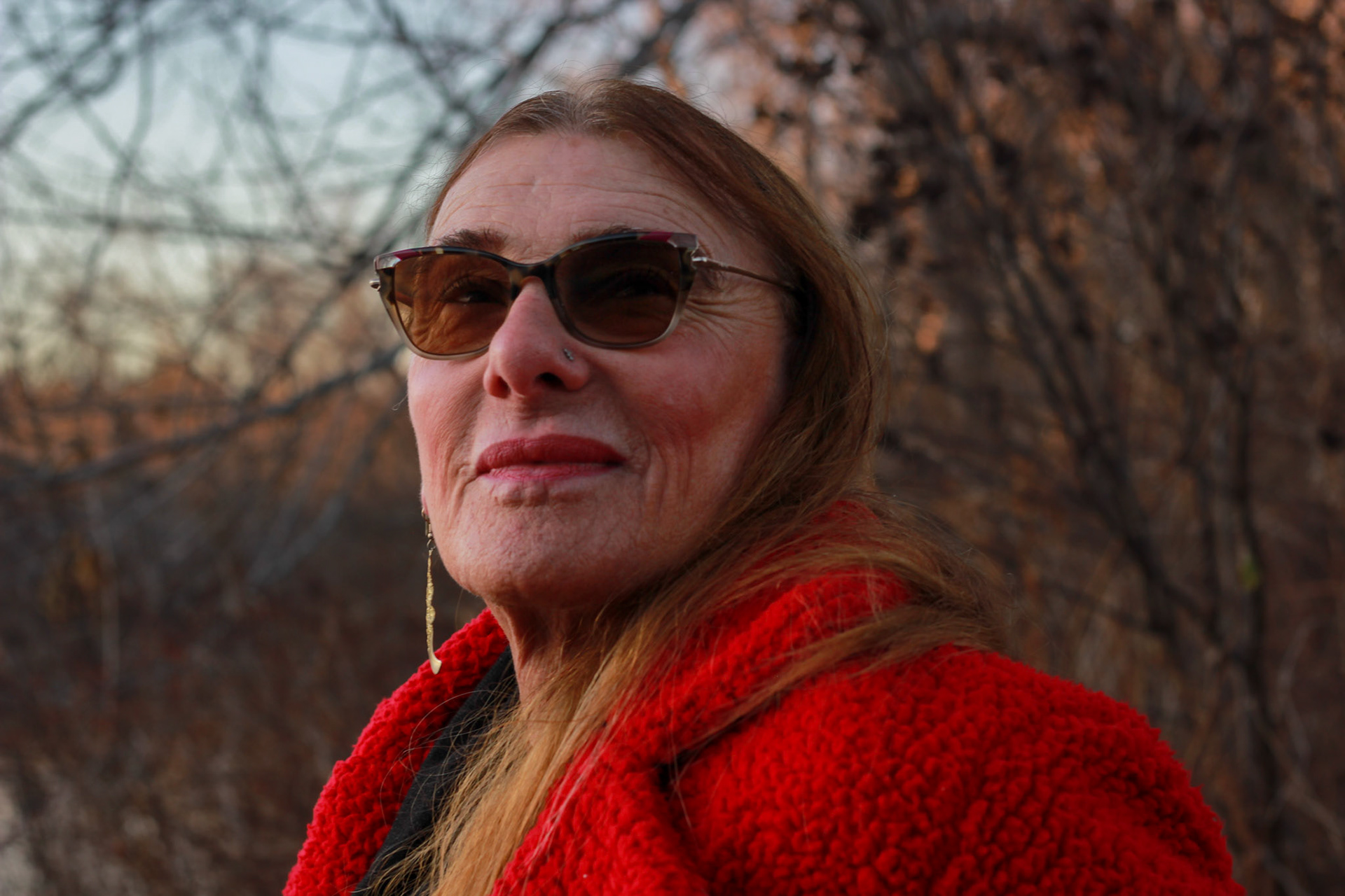 Gaby, She/Her . “I’m Gaby, and I’m a car girl.” Though officially retired, Gaby is an experienced car mechanic in Lisbon Falls, ME. offering repairs to LGBTQ+ folks through her shop. Keeping car costs affordable for the community and mentoring LGBTQ+ folks looking to enter a historically cisgender heterosexual male dominated field, she hopes to create a space where LGBTQ+ can feel empowered in their craft, and welcome."