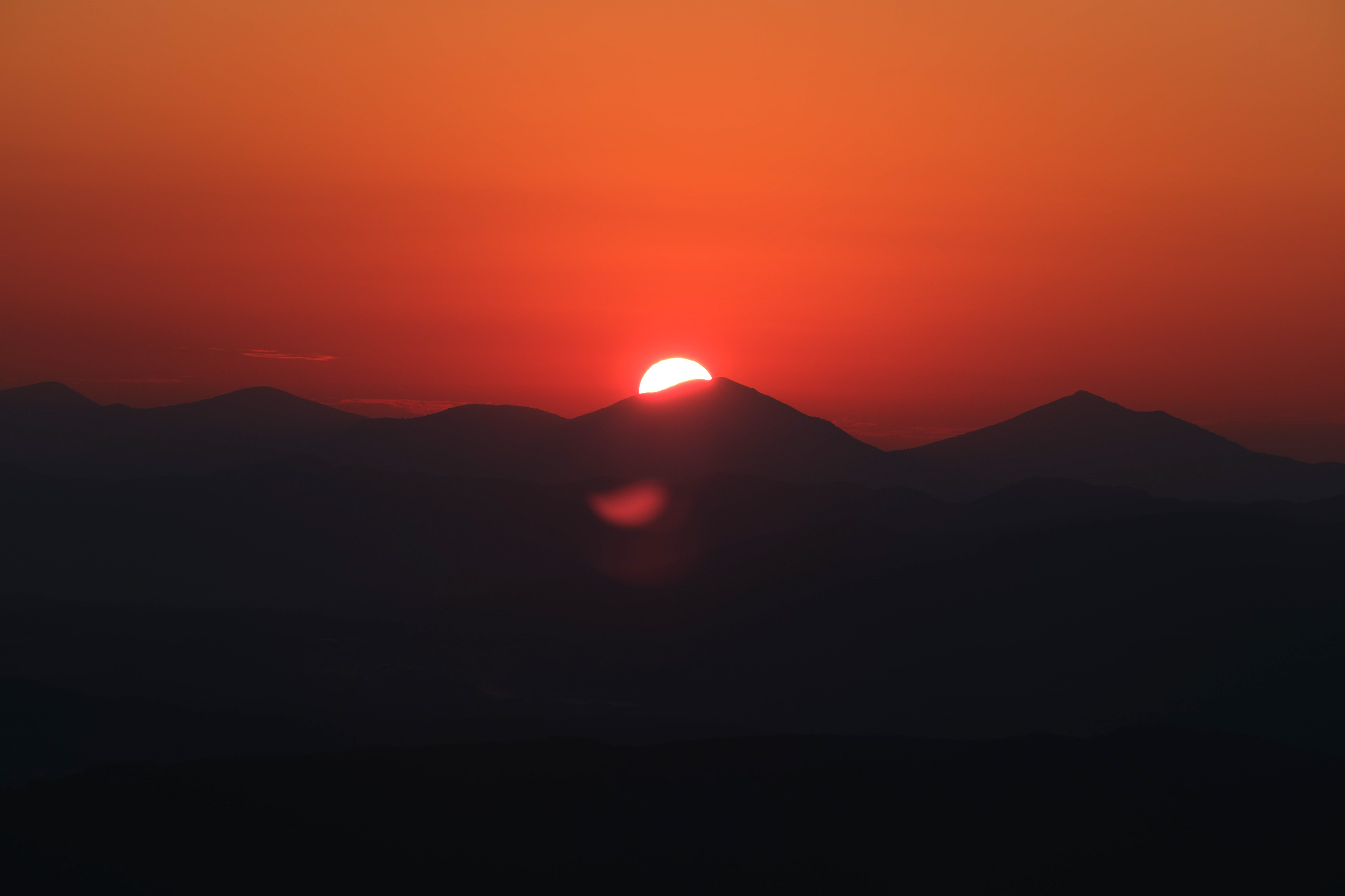 The first glimpse of the sun over the Blue Ridge Mountains