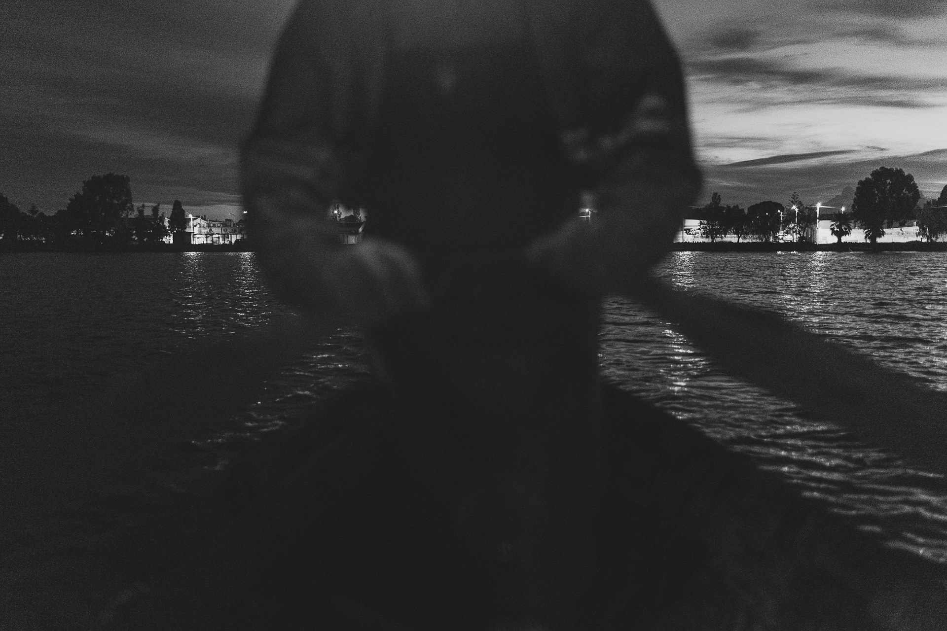 06:06 AM. Tarcisio as he leaves Elmas behind, the town on the shores of the lagoon where his boat docks daily.