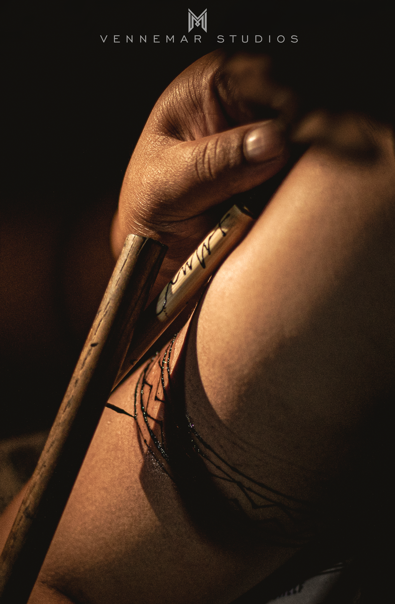 The traditional hand-tapped tattoo process.