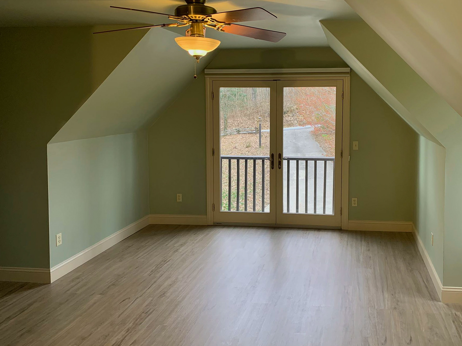 French doors with a small balcony added great curbside appeal.