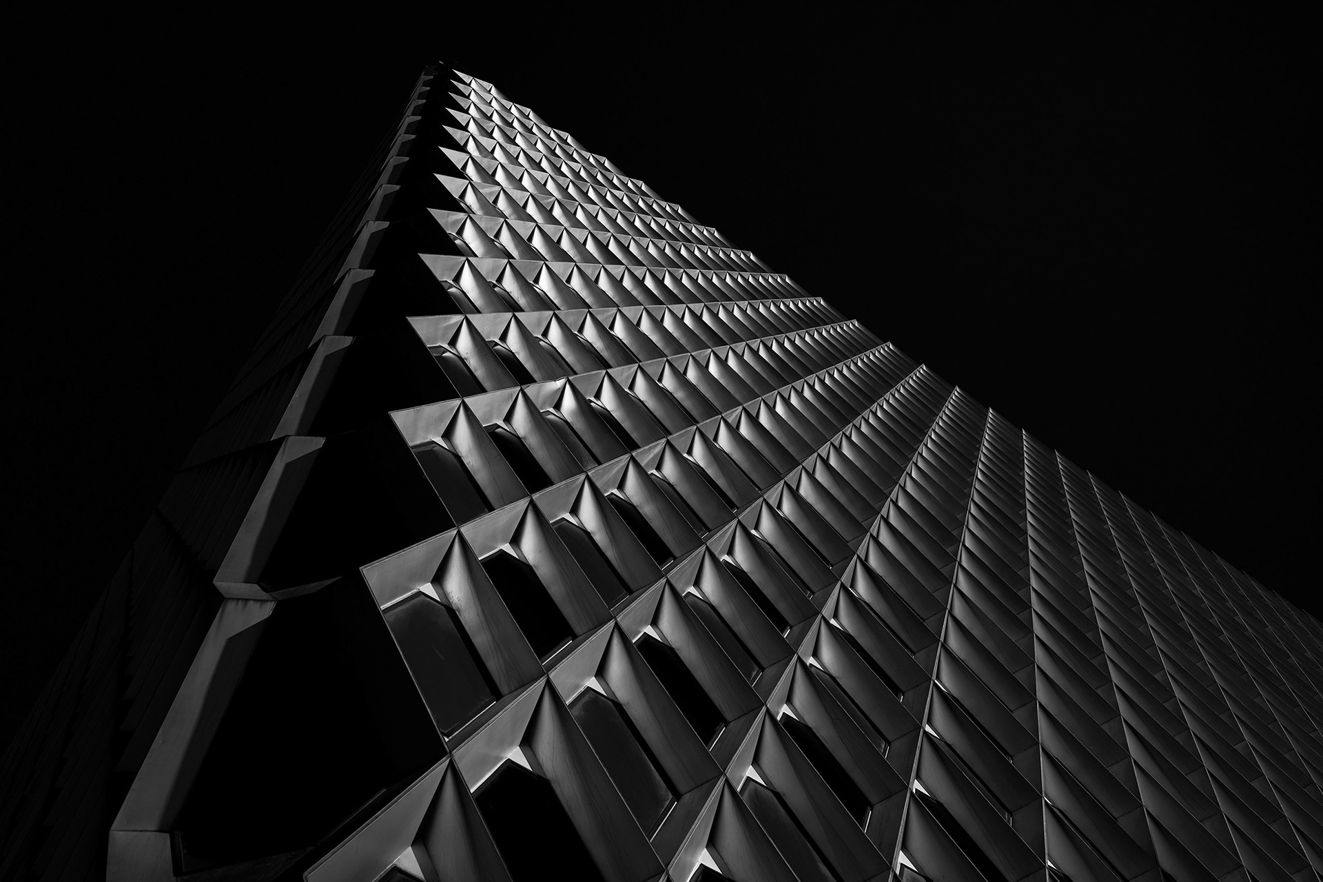 Repetitive architectural pattern and dynamic perspective. Studio work by Bucchianeri in black and white.