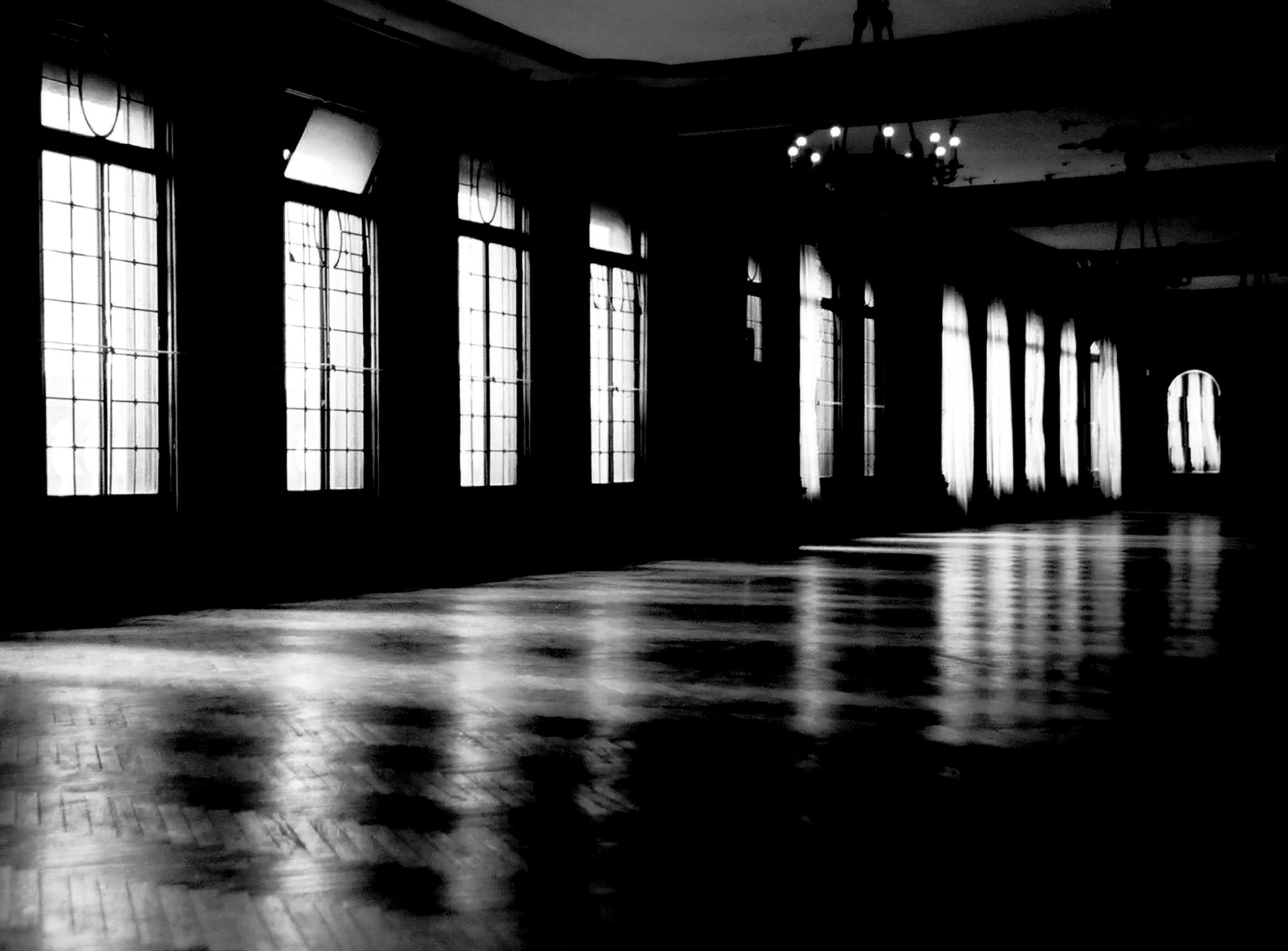 Symmetrical hallway with reflected light and repetition. Photograph by Bucchianeri for the Studios collection.